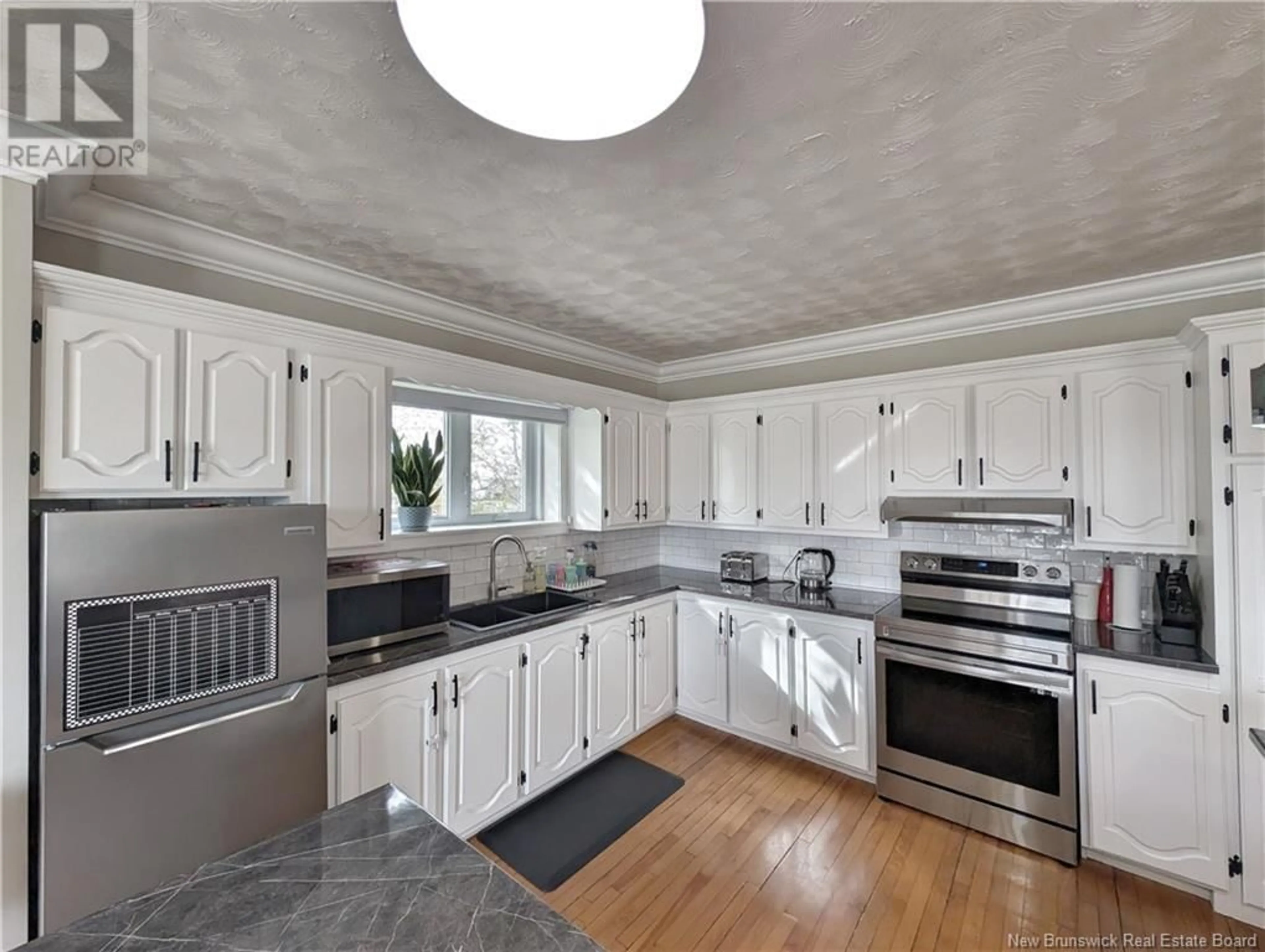 Open concept kitchen for 92 du Pêcheur Street, Lamèque New Brunswick E8T1J6