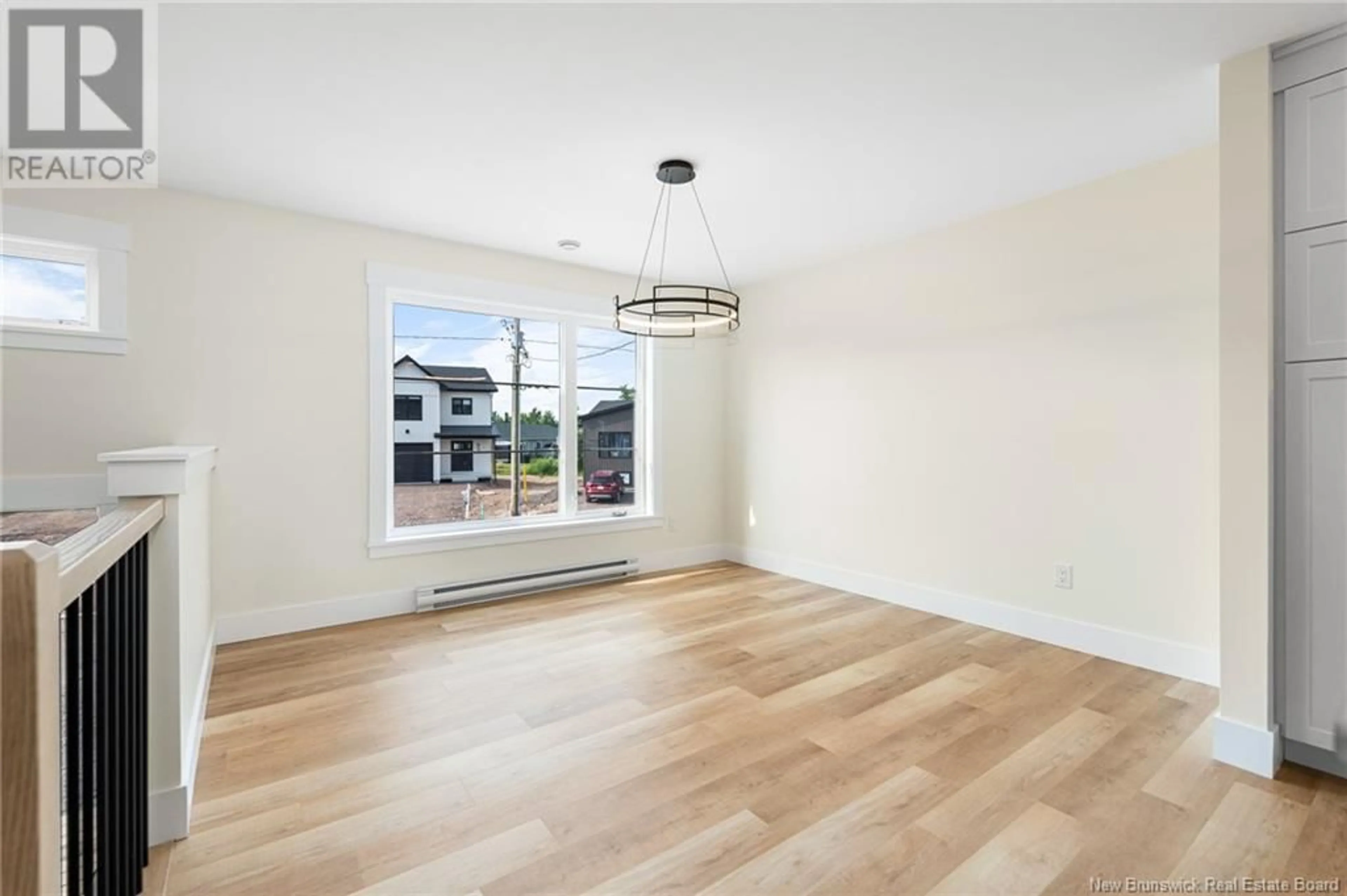 A pic of a room, wood floors for 100 Ernest Street, Dieppe New Brunswick E1A4T2