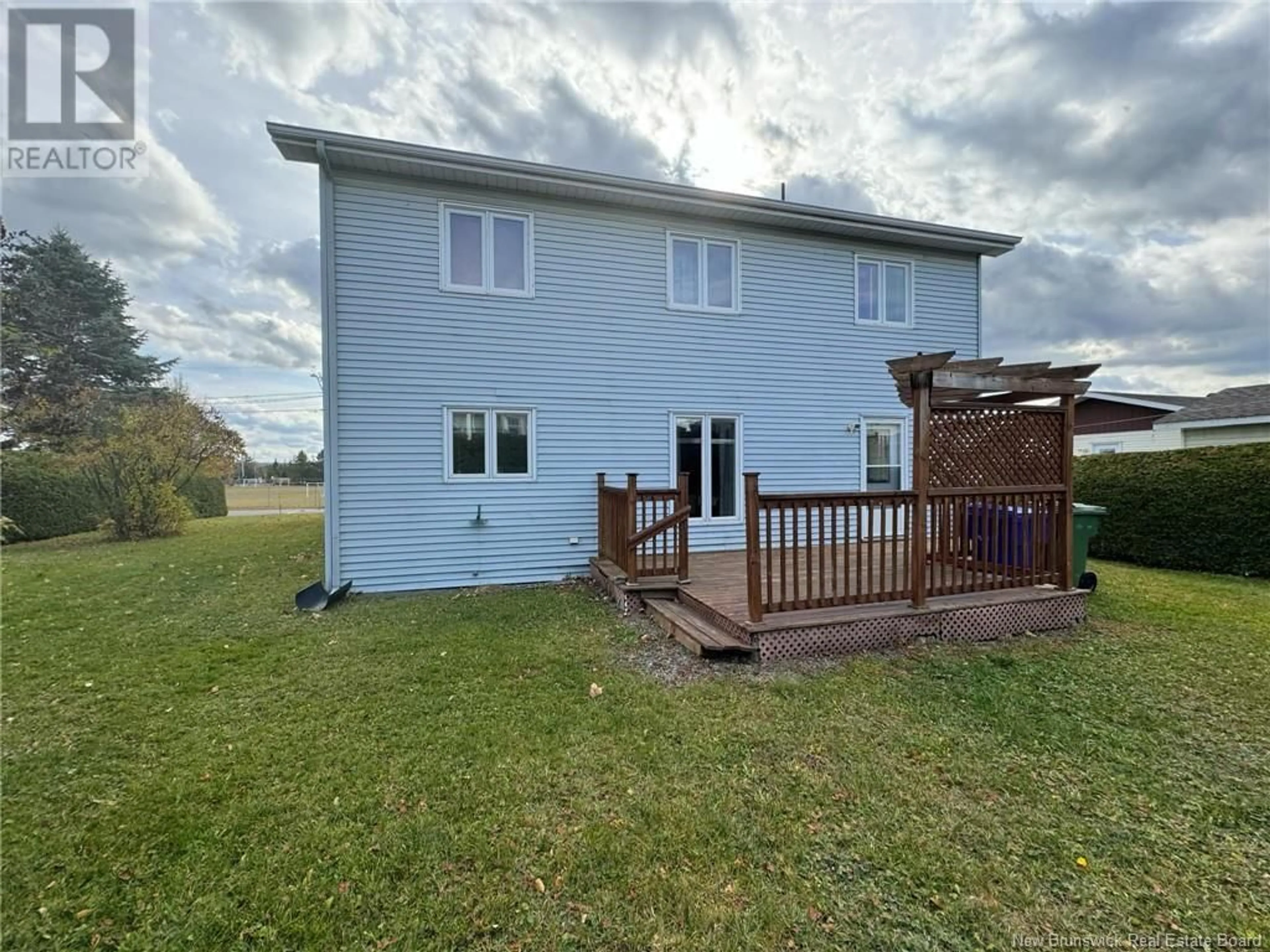 Frontside or backside of a home, the fenced backyard for 24 rue Deschênes, Saint-Quentin New Brunswick E8A1M1