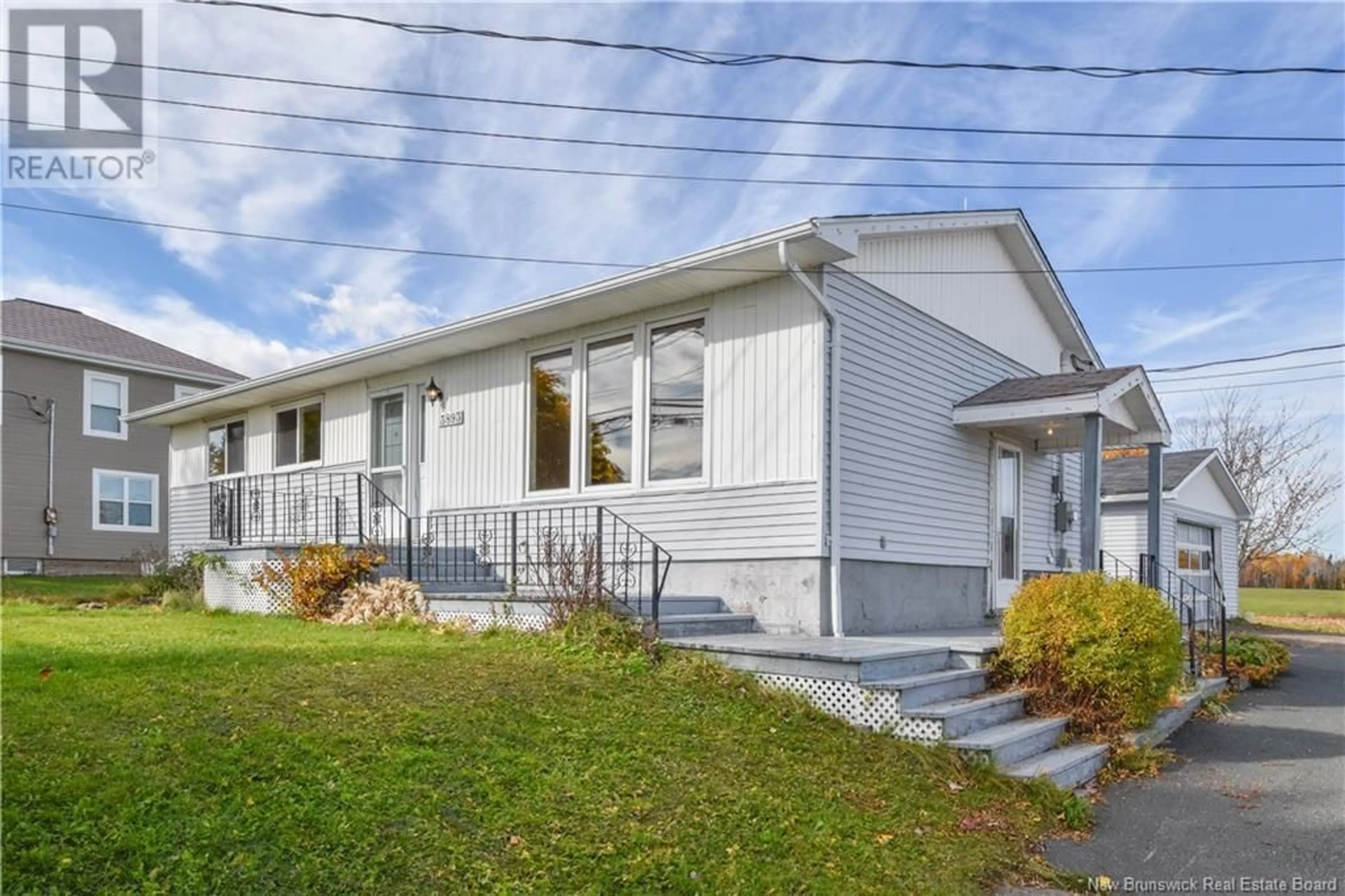 Home with vinyl exterior material, street for 3893 DES FONDATEURS BOULEVARD, Saint-Isidore New Brunswick E8M1C1