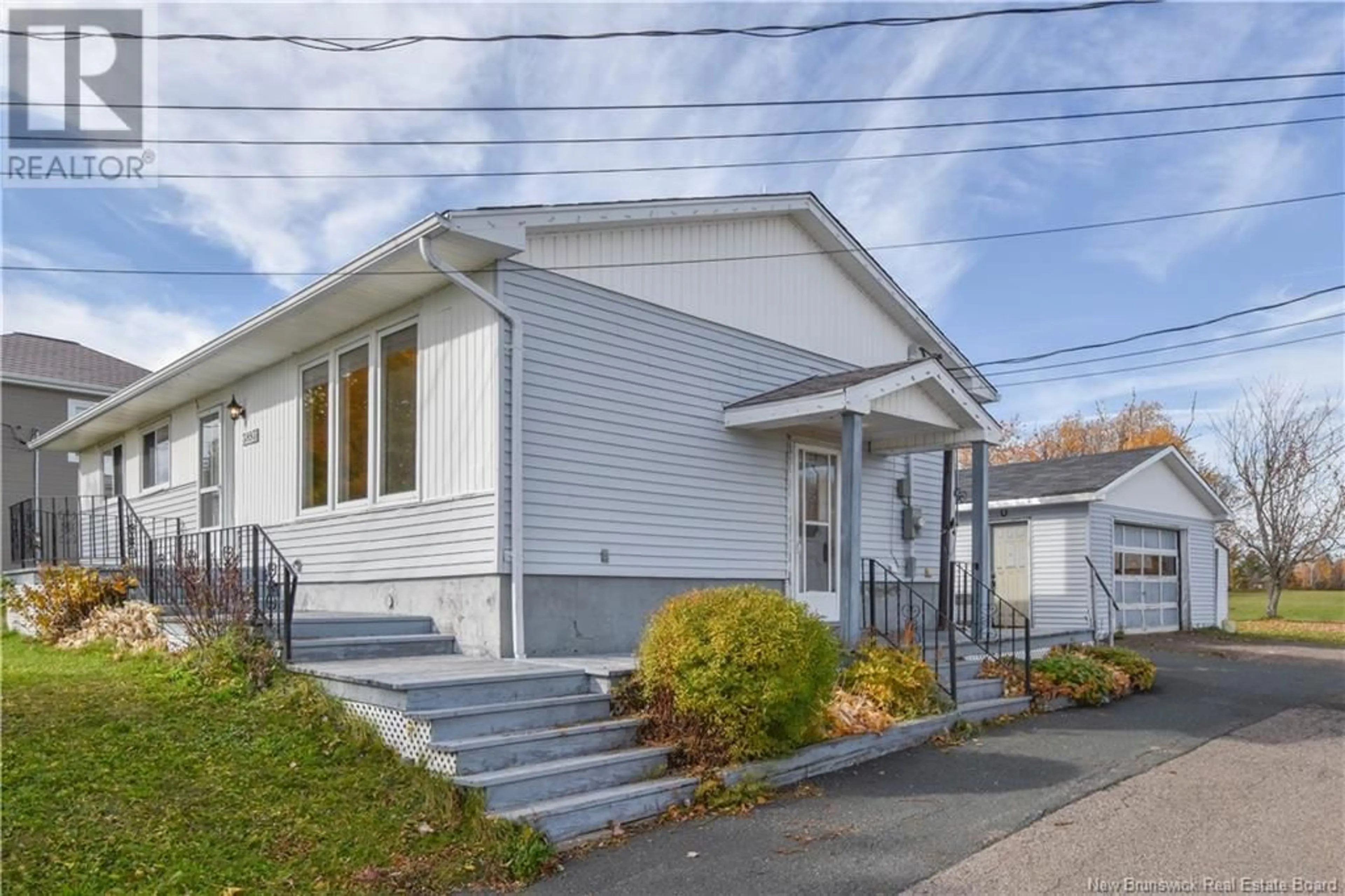 Home with vinyl exterior material, street for 3893 DES FONDATEURS BOULEVARD, Saint-Isidore New Brunswick E8M1C1