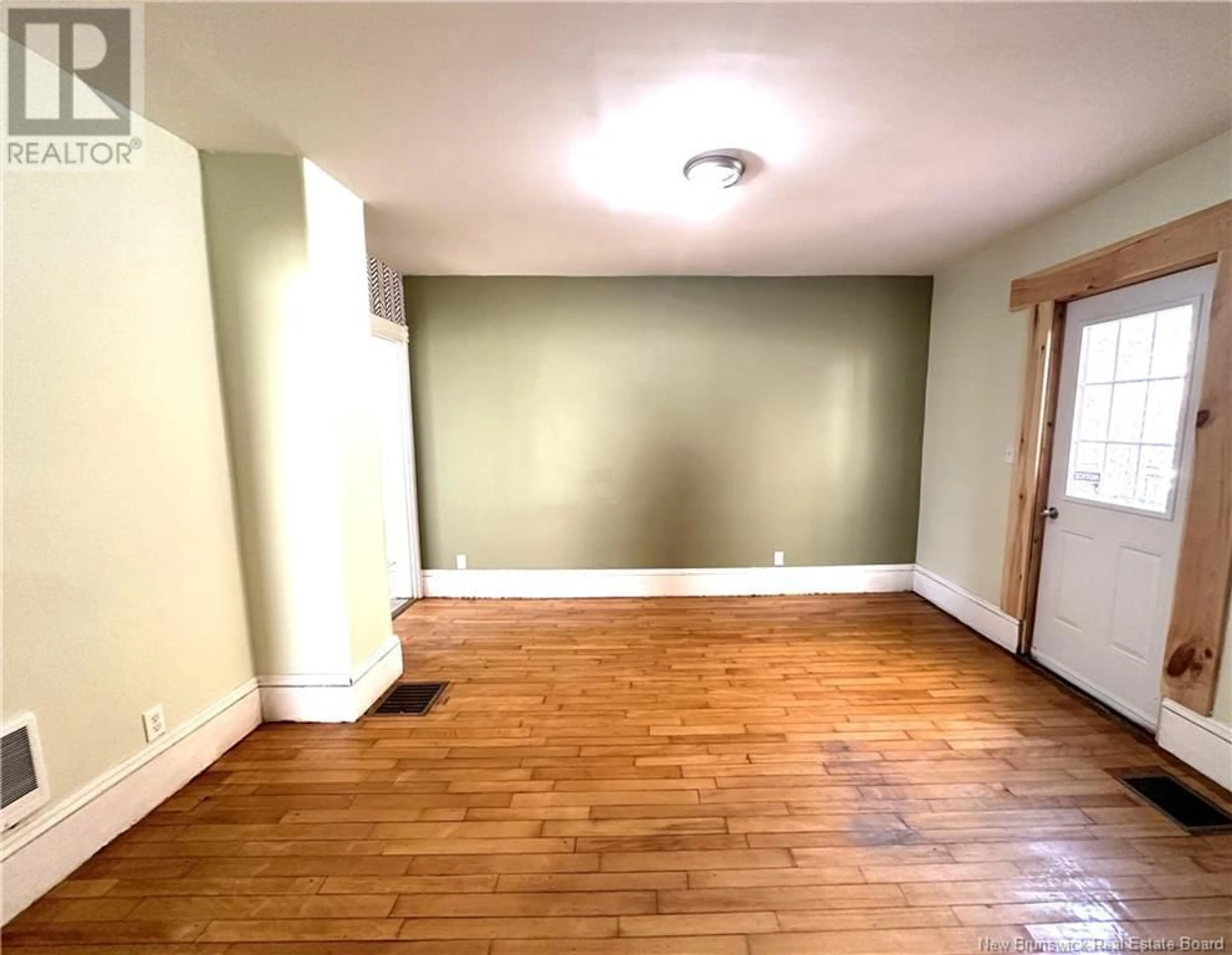 A pic of a room, wood floors for 43 Parkwood Drive, St. Stephen New Brunswick E3L2W1