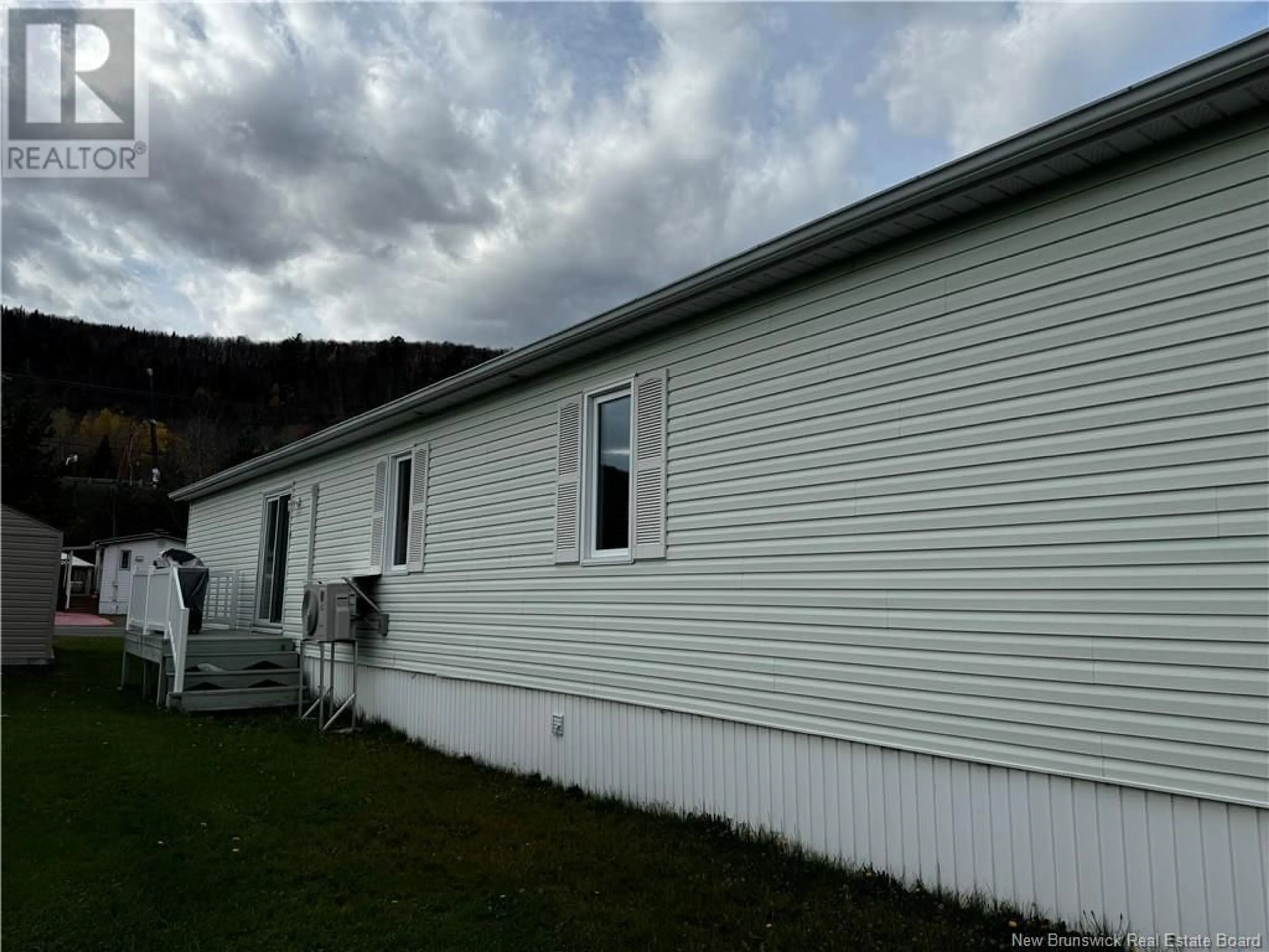 Home with vinyl exterior material for 47 Parc Ptiso Street, Edmundston New Brunswick E3V3X7