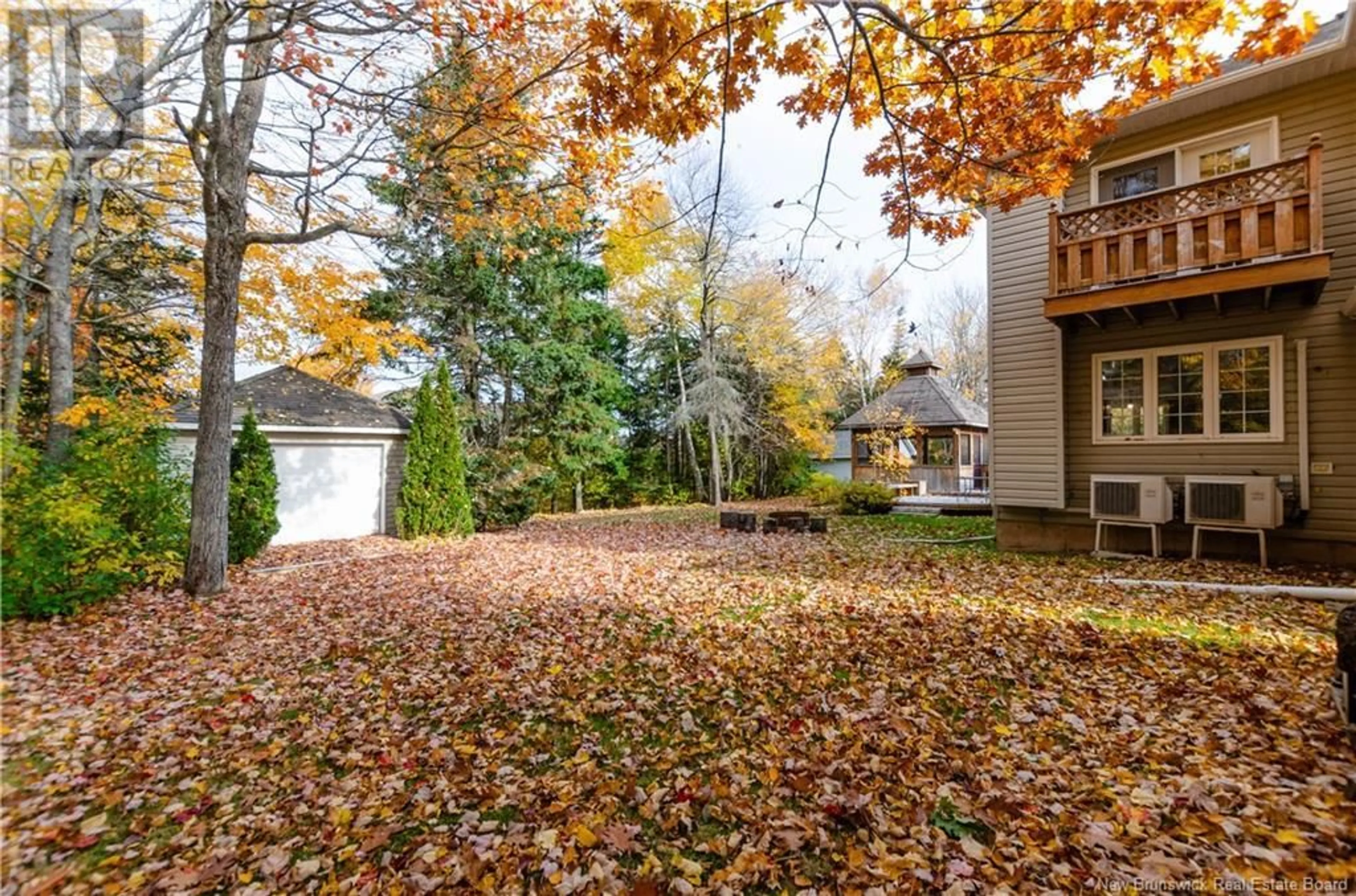 A pic from exterior of the house or condo, the fenced backyard for 394 Ouellet, Shediac New Brunswick E4P2K7