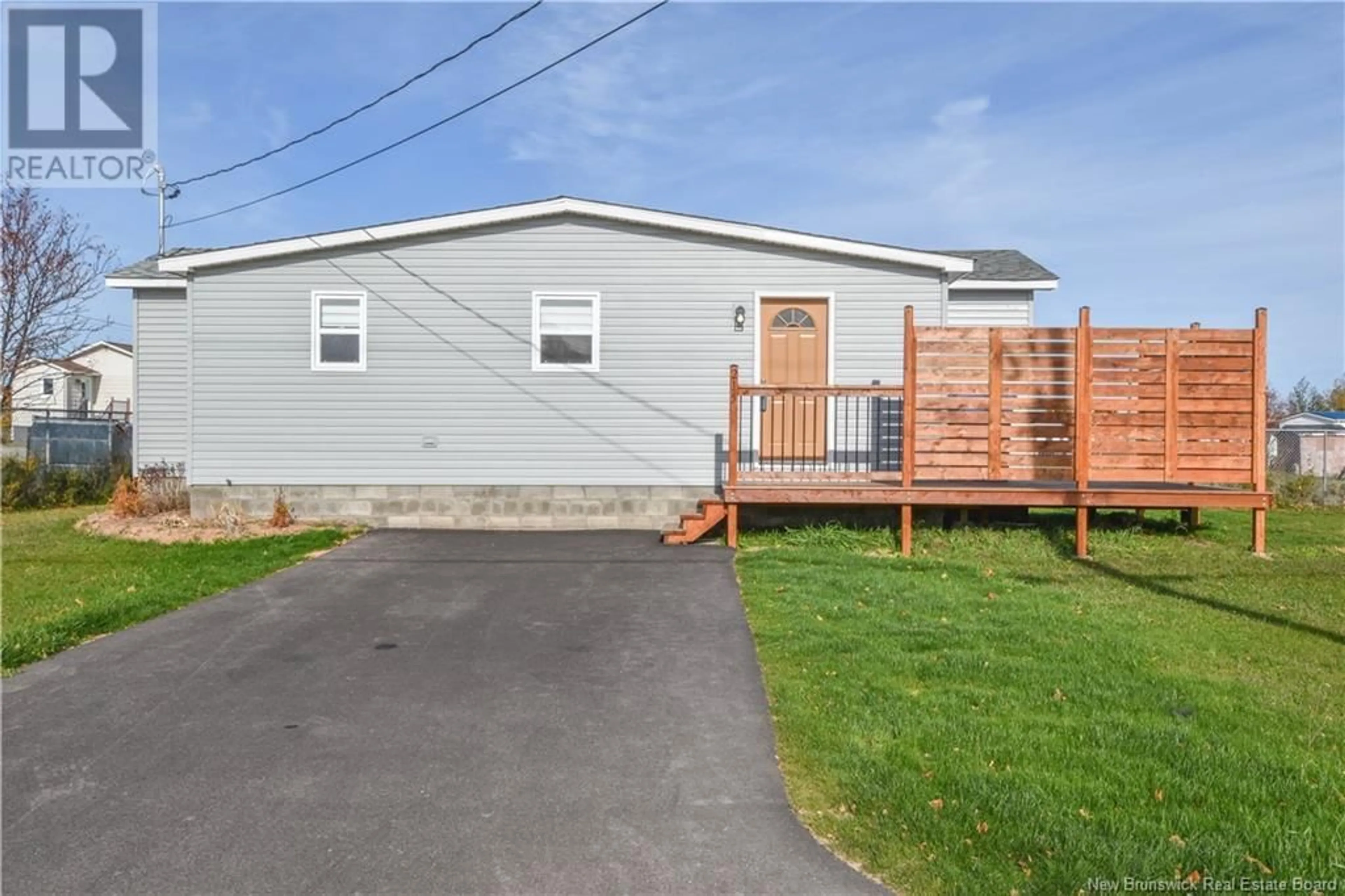 A pic from exterior of the house or condo, the fenced backyard for 215 2e rue Street, Shippagan New Brunswick E8S1T4