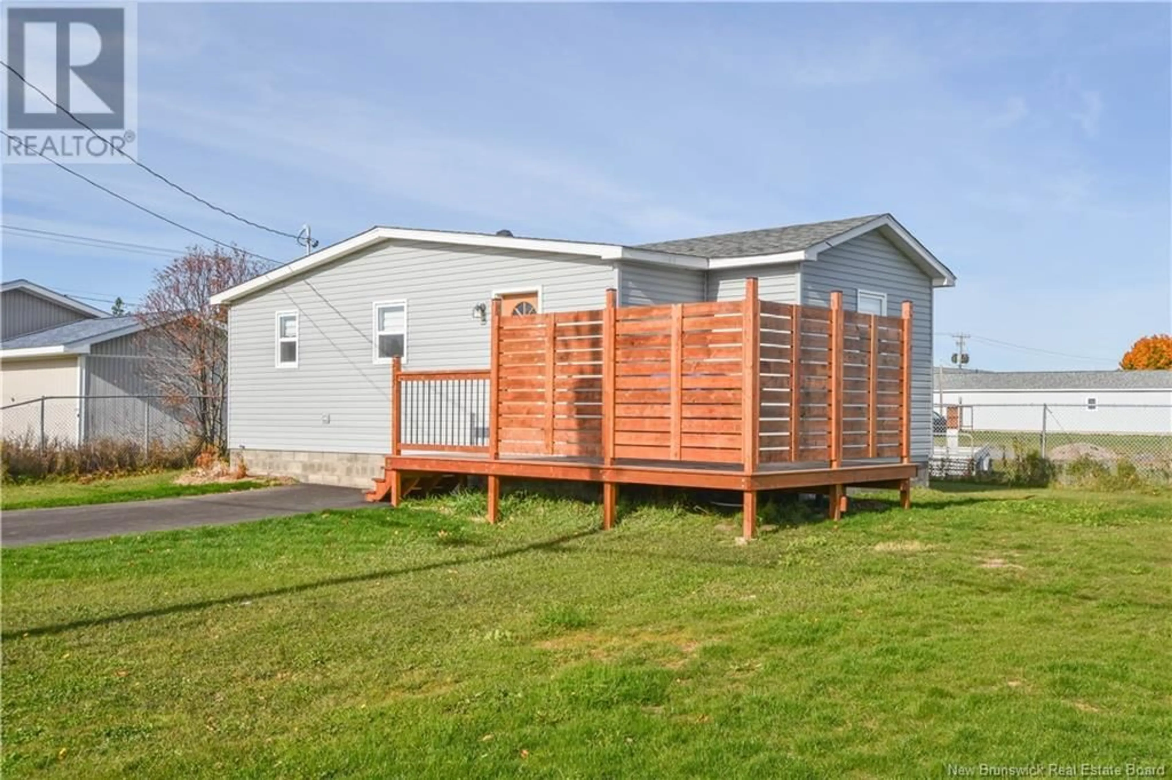 Frontside or backside of a home, the fenced backyard for 215 2e rue Street, Shippagan New Brunswick E8S1T4