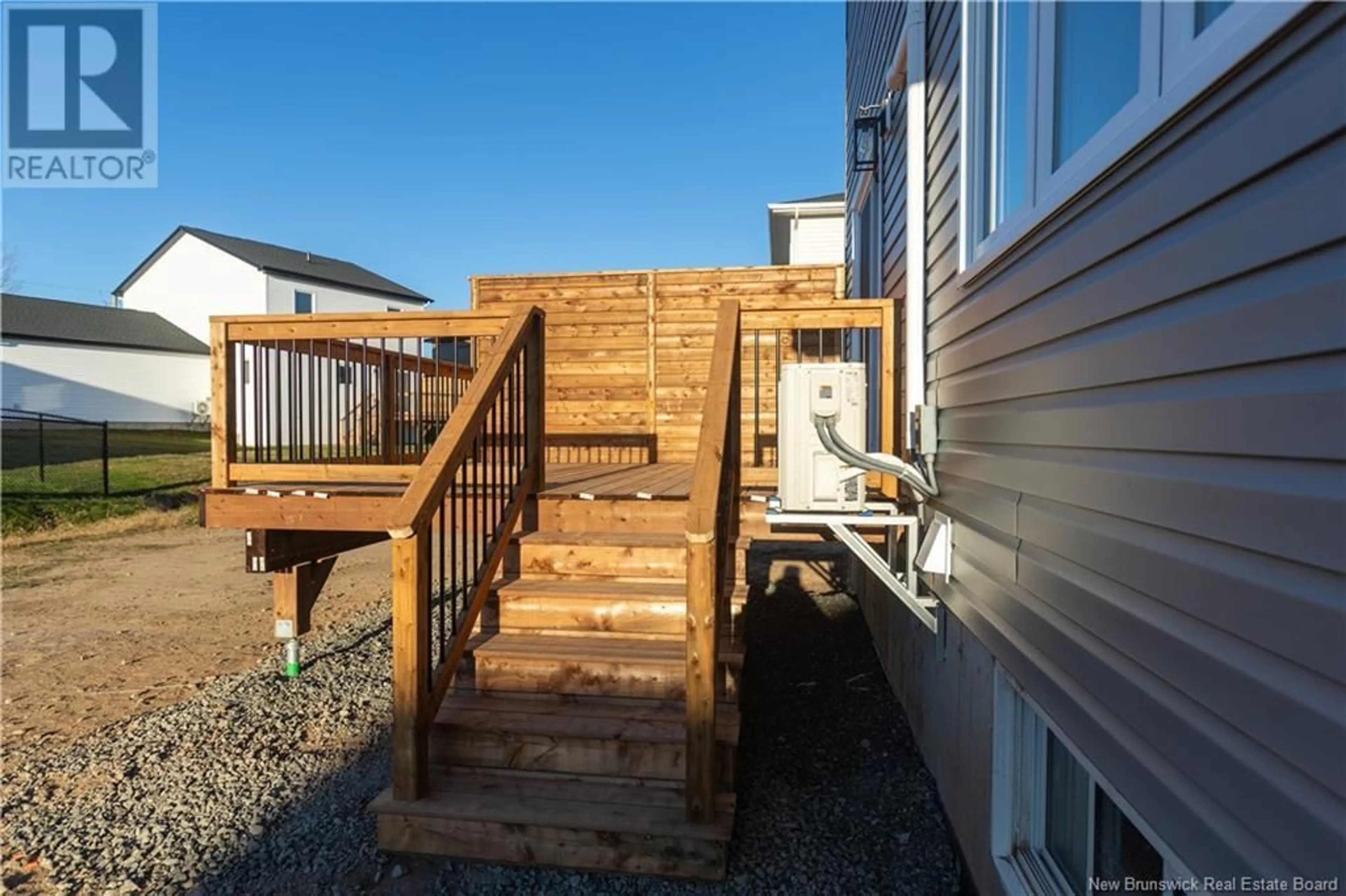 Frontside or backside of a home, the fenced backyard for 55 Belidor Street, Moncton New Brunswick E1G5V5