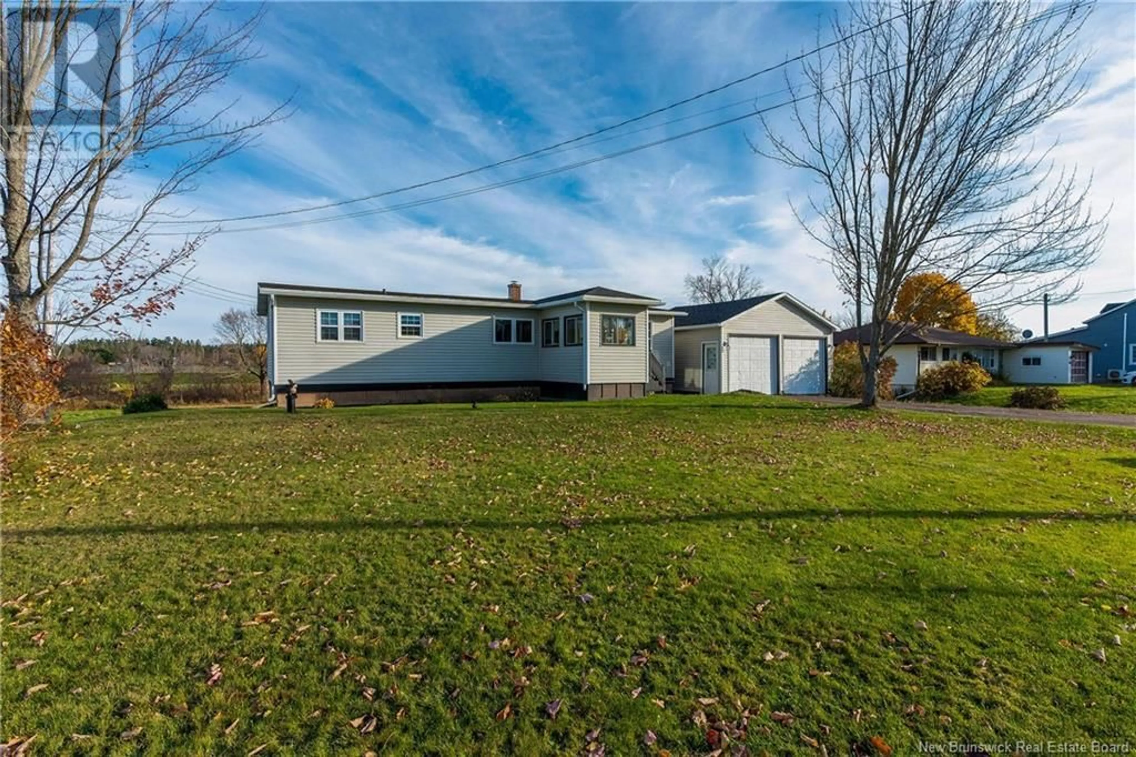 Frontside or backside of a home, the fenced backyard for 104 Old Post Road, Petitcodiac New Brunswick E4Z4N9