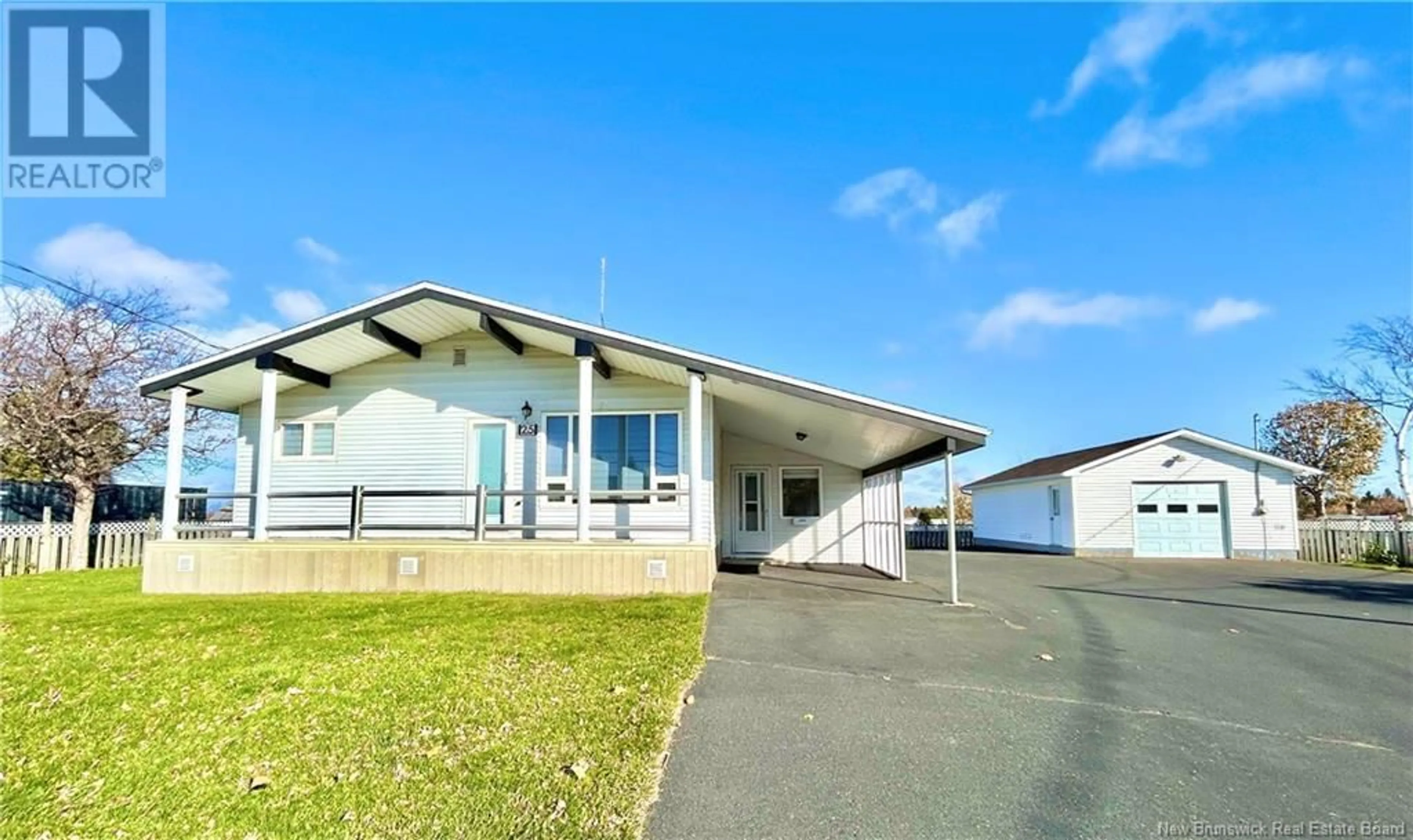 Frontside or backside of a home, the front or back of building for 25 St-Simon Road, Caraquet New Brunswick E1W1B3