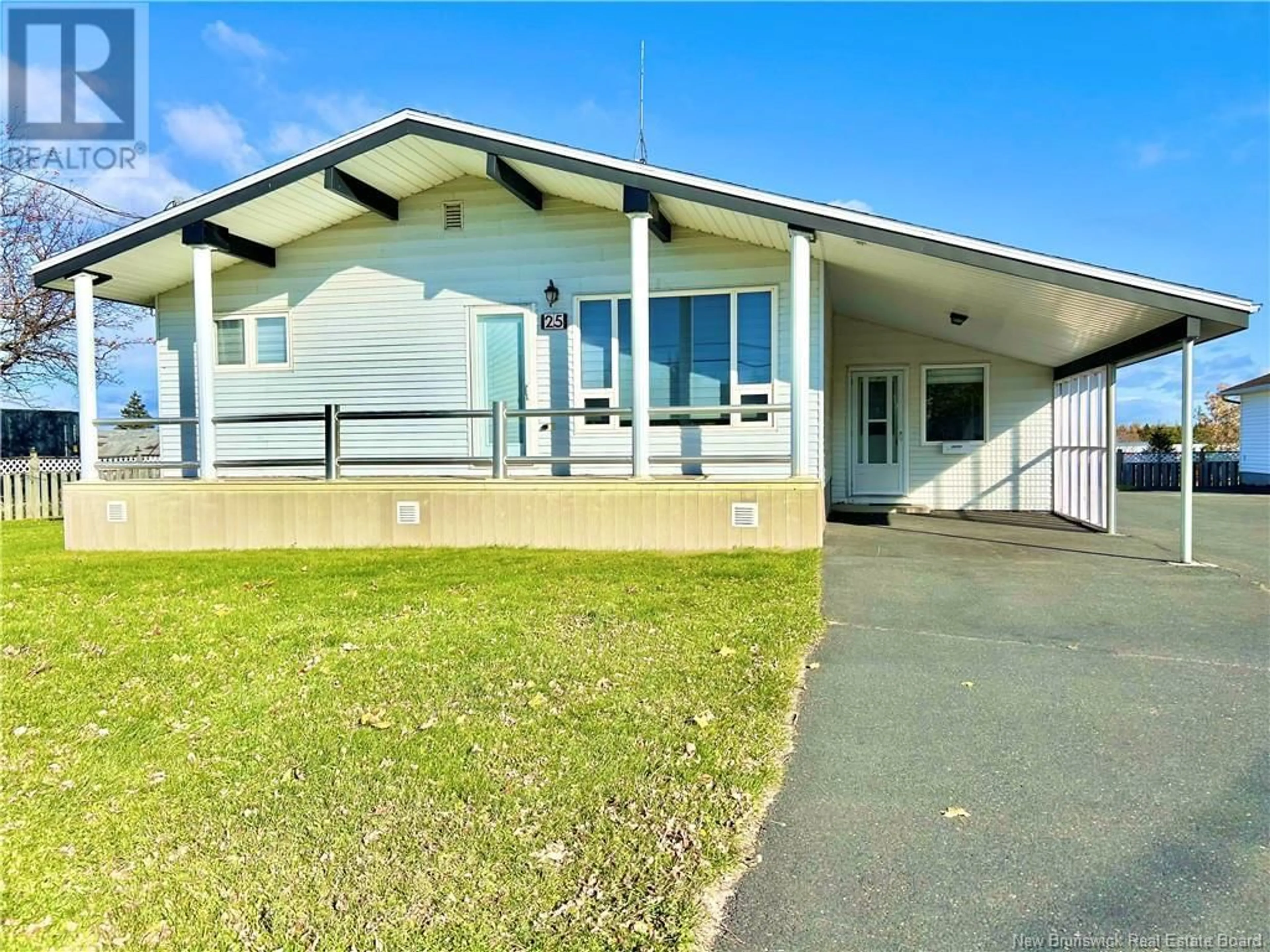 Frontside or backside of a home, the front or back of building for 25 St-Simon Road, Caraquet New Brunswick E1W1B3