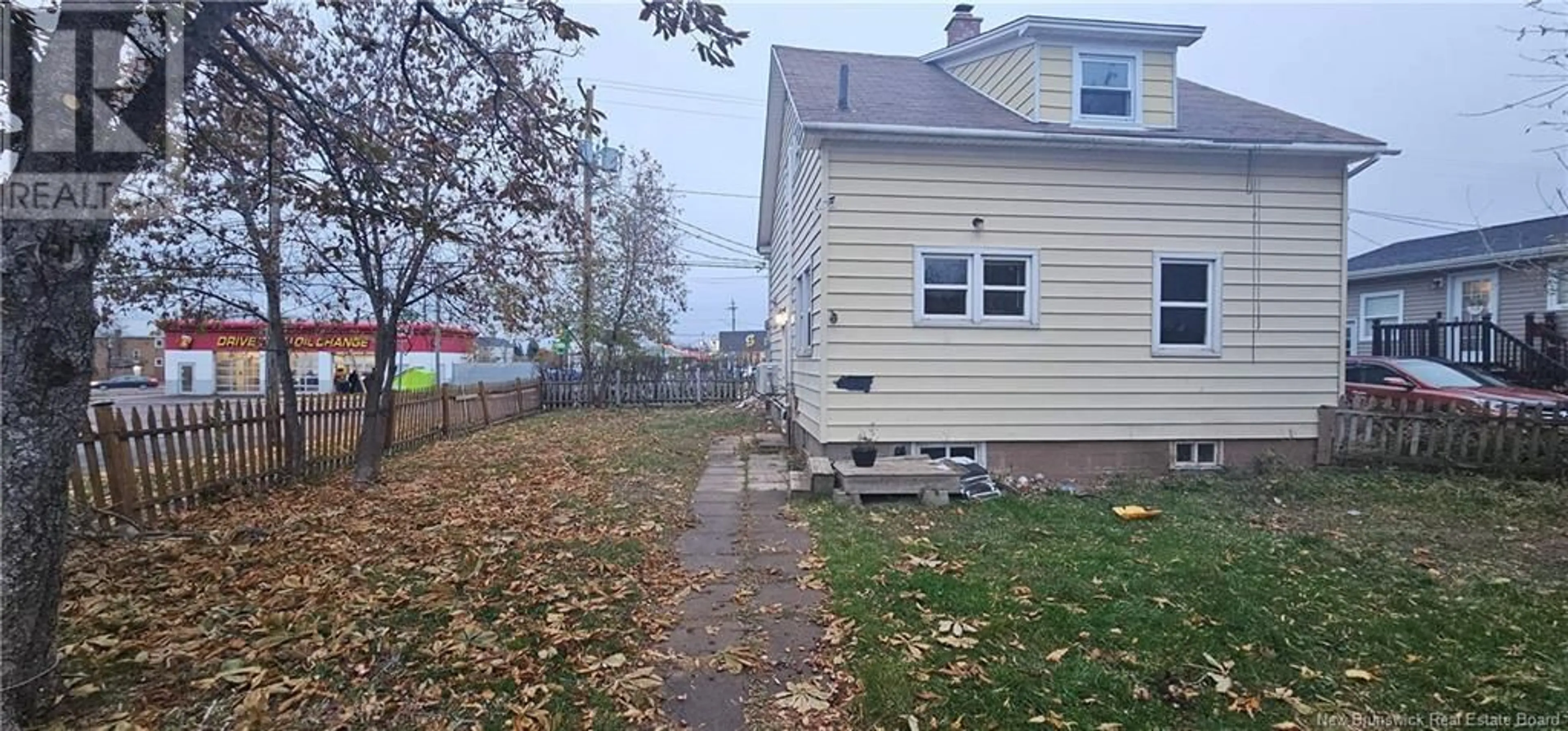 Frontside or backside of a home, the fenced backyard for 100 Oakland Avenue, Moncton New Brunswick E1C7P1