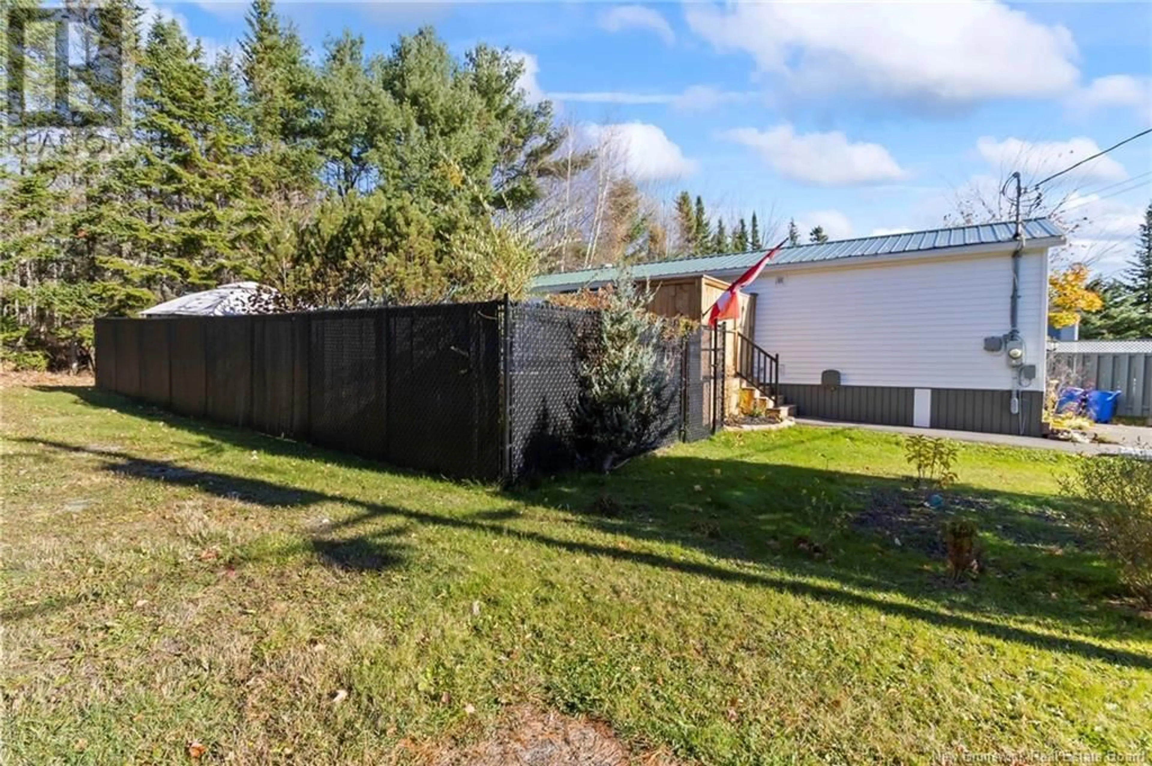 Frontside or backside of a home, the fenced backyard for 17 Bentley, Moncton New Brunswick E1E4L1