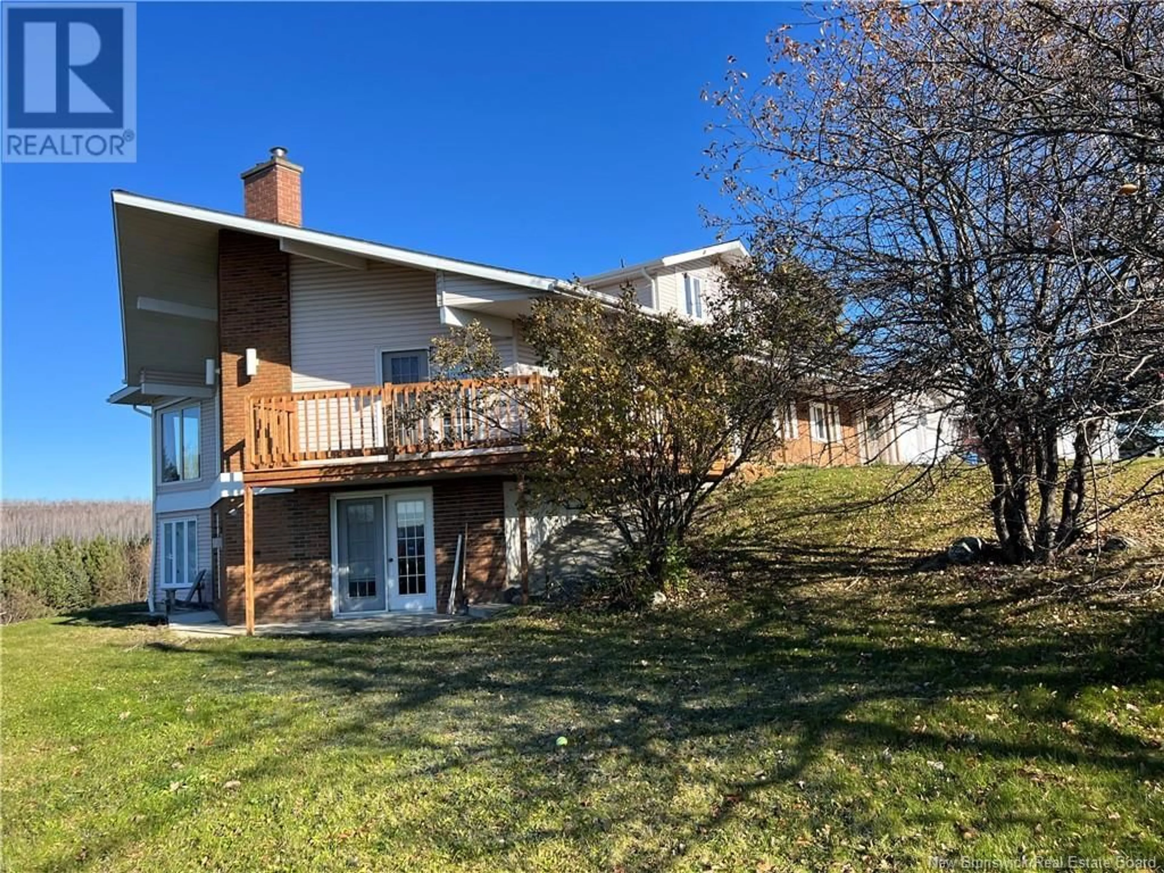 Frontside or backside of a home, the fenced backyard for 245 Beaulieu Street, Grand-Sault/Grand Falls New Brunswick E3Y1E4