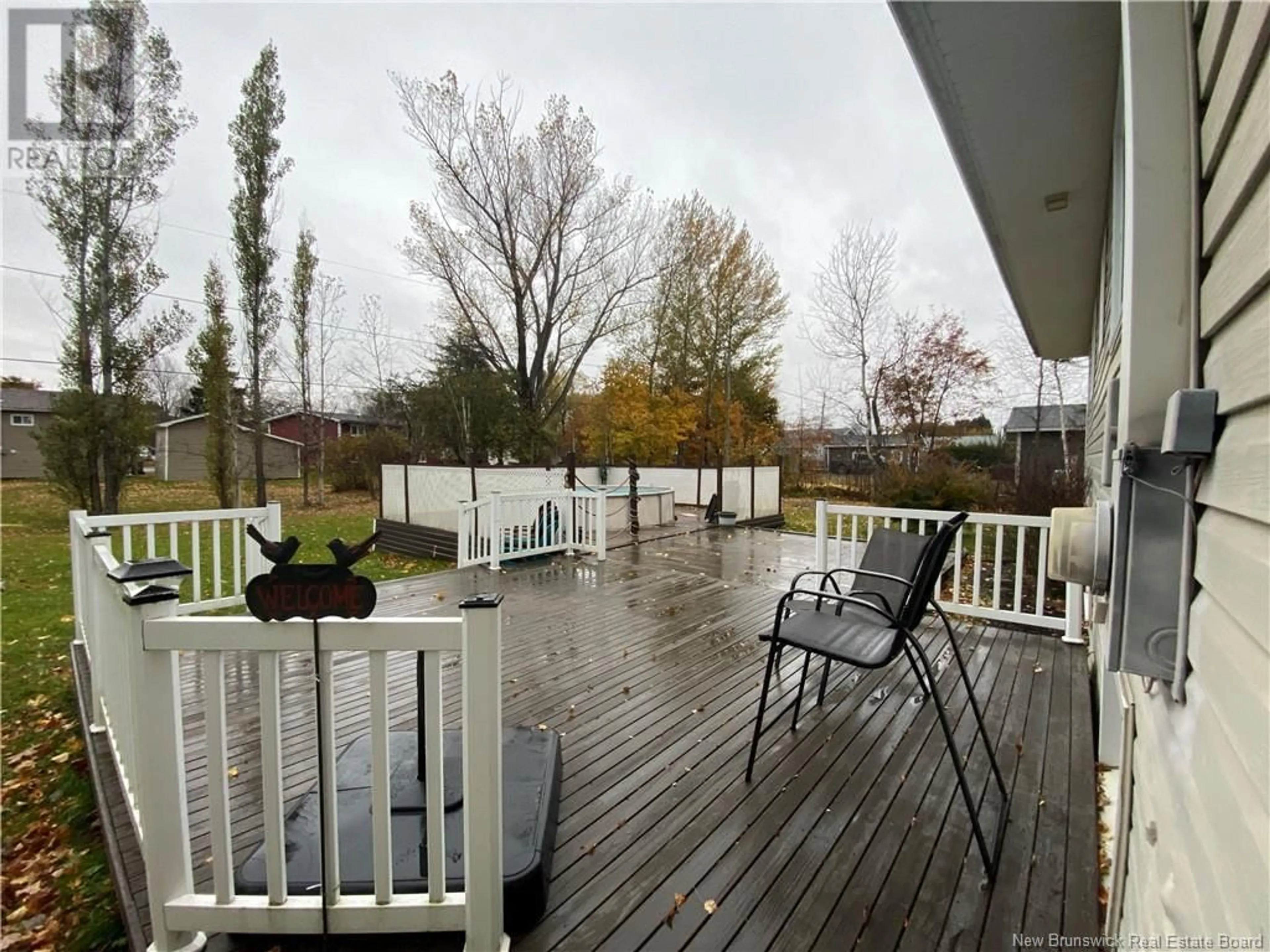 Patio, the fenced backyard for 211 Foulem, Beresford New Brunswick E8K1N1