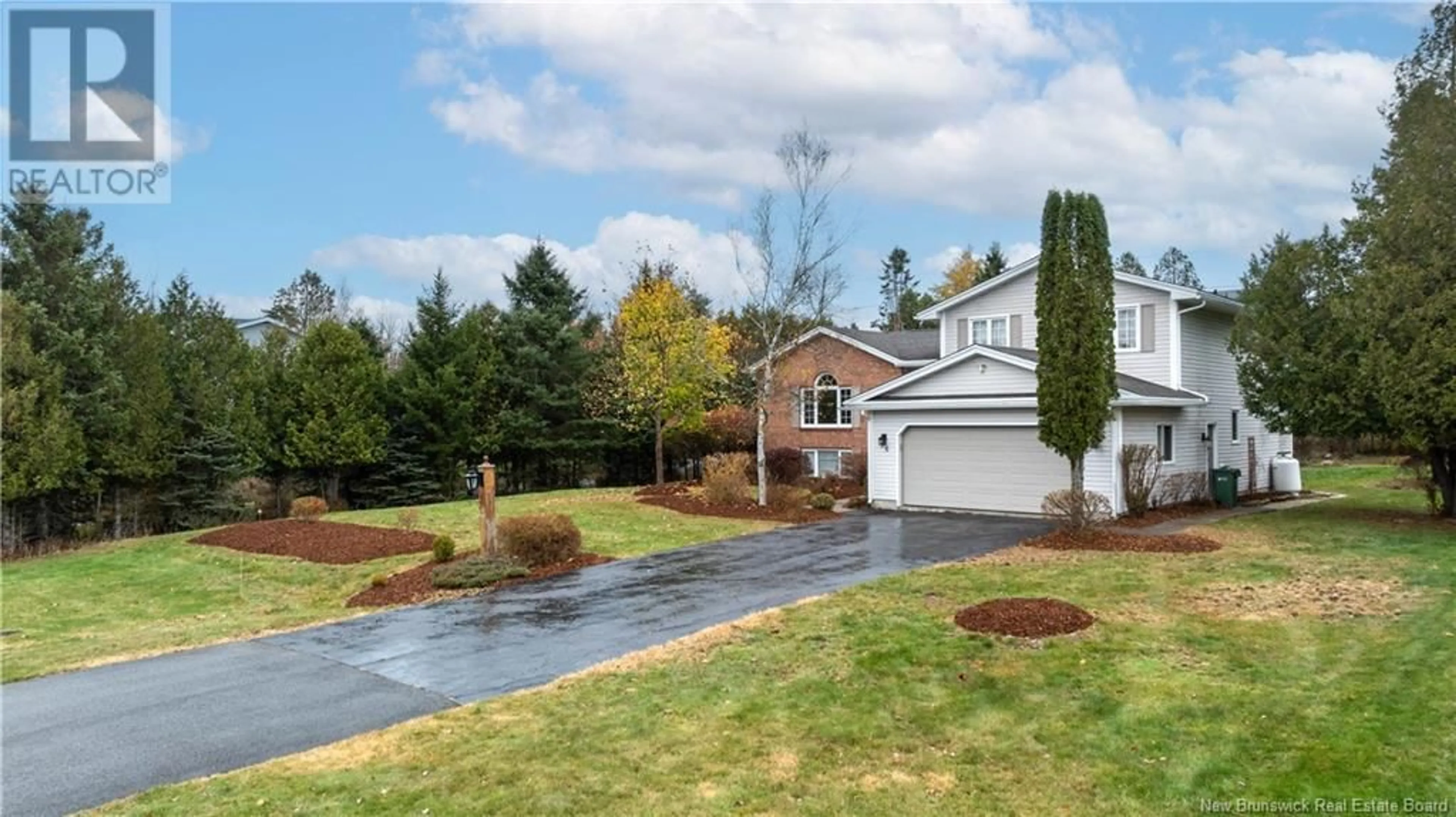 Frontside or backside of a home, the fenced backyard for 16 Melanie Drive, Quispamsis New Brunswick E2E1V9