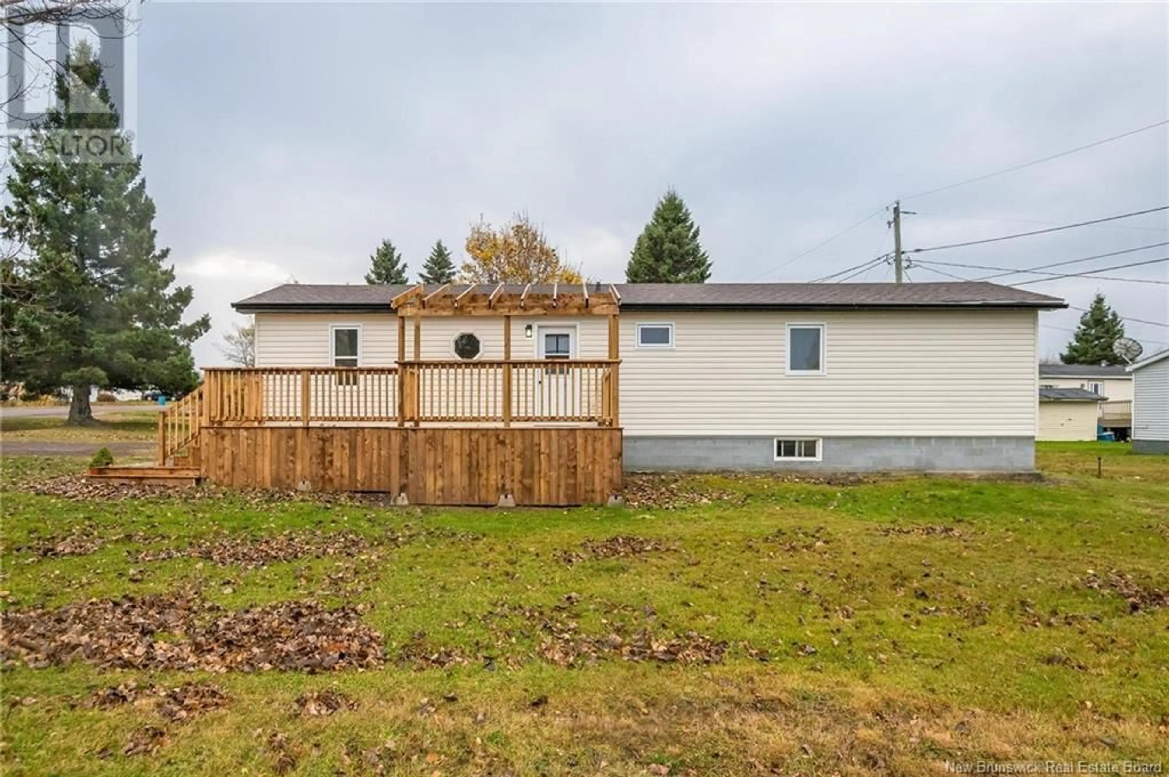 Frontside or backside of a home, the fenced backyard for 20 Tait Crescent, Lakeville New Brunswick E1H1K5