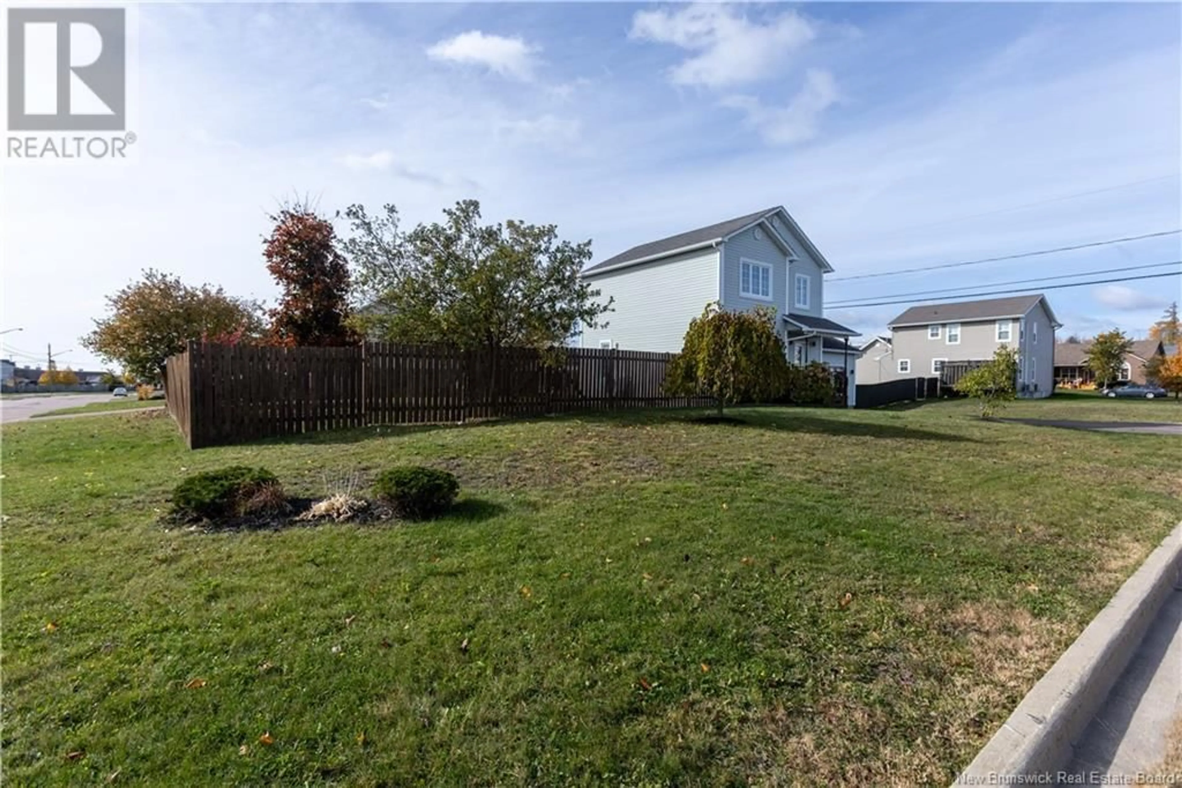 Frontside or backside of a home, the fenced backyard for 2 Thistlevale Drive, Moncton New Brunswick E1G5L1