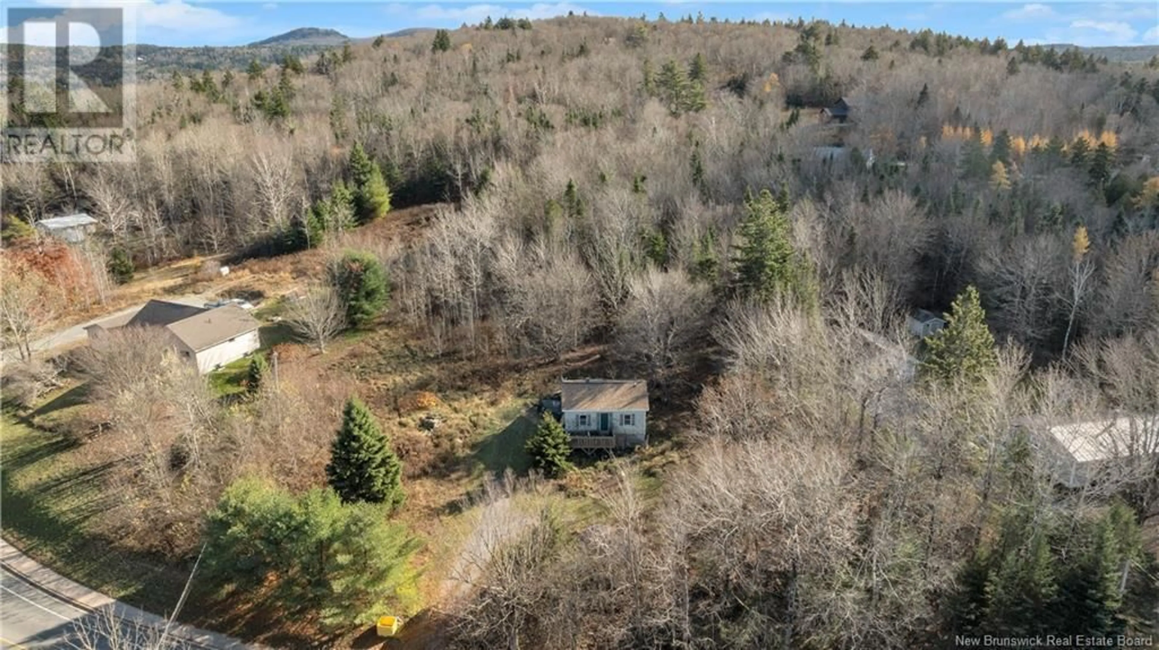 A pic from exterior of the house or condo, the fenced backyard for 92 French Village Road, Rothesay New Brunswick E2S1A3