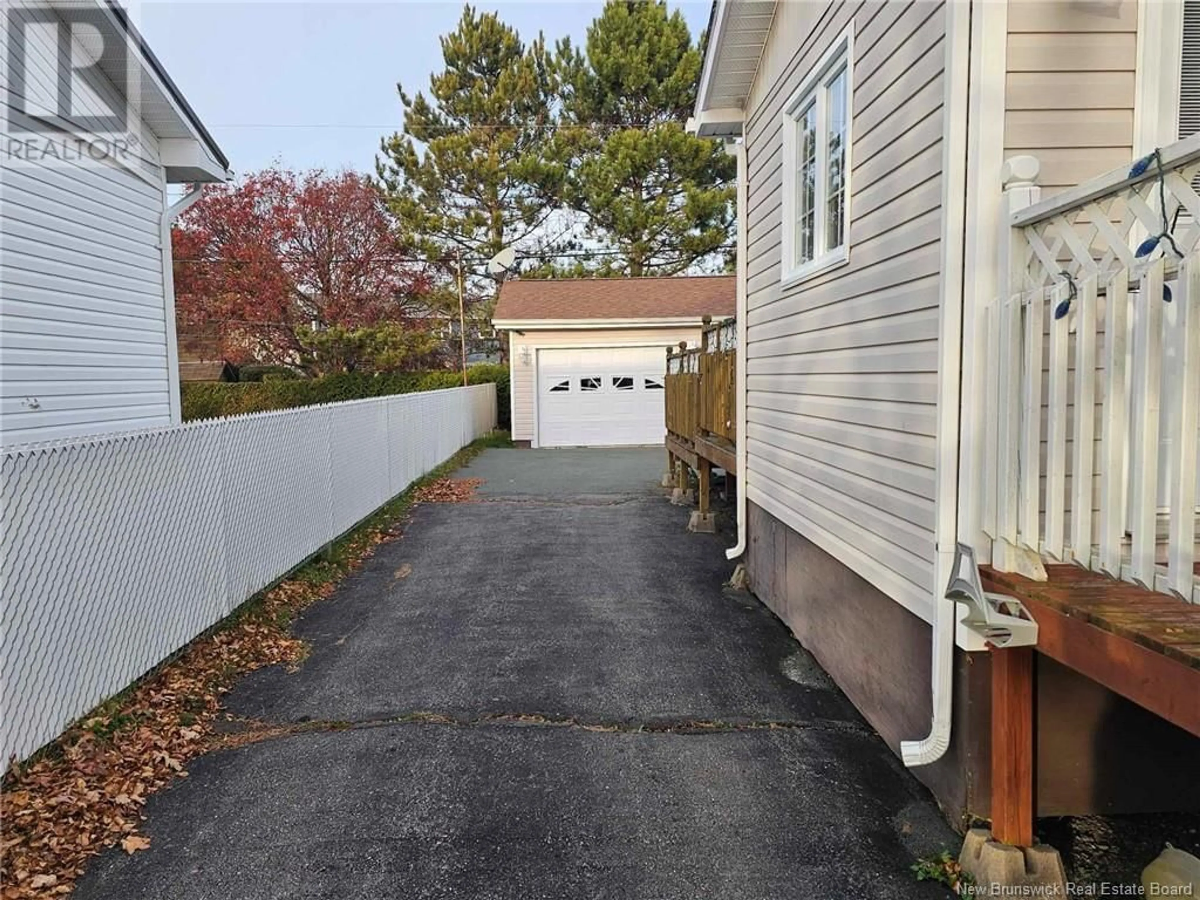 Frontside or backside of a home, the fenced backyard for 563 FLEET Crescent, Bathurst New Brunswick E2A4H2