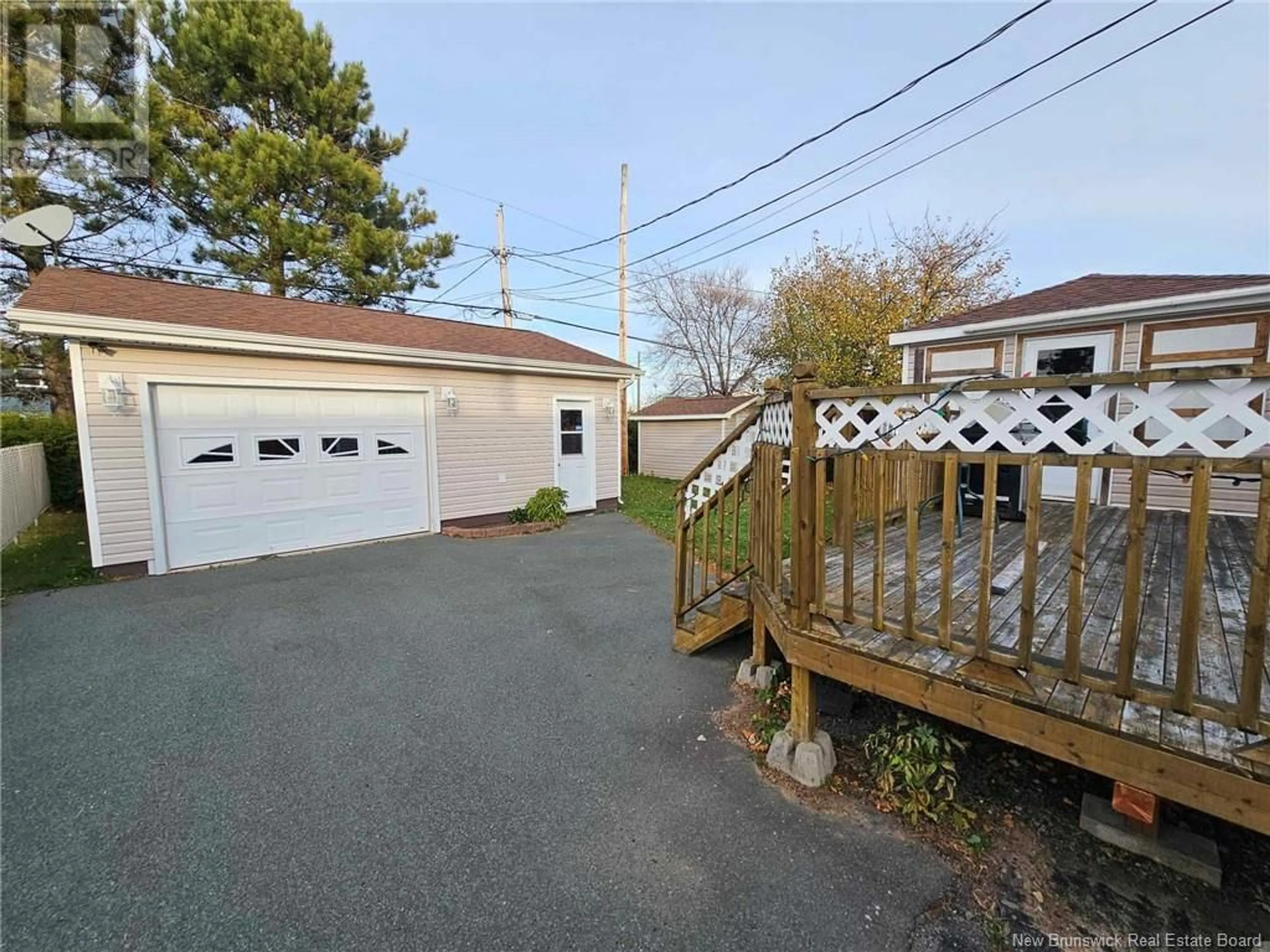 Frontside or backside of a home, the fenced backyard for 563 FLEET Crescent, Bathurst New Brunswick E2A4H2