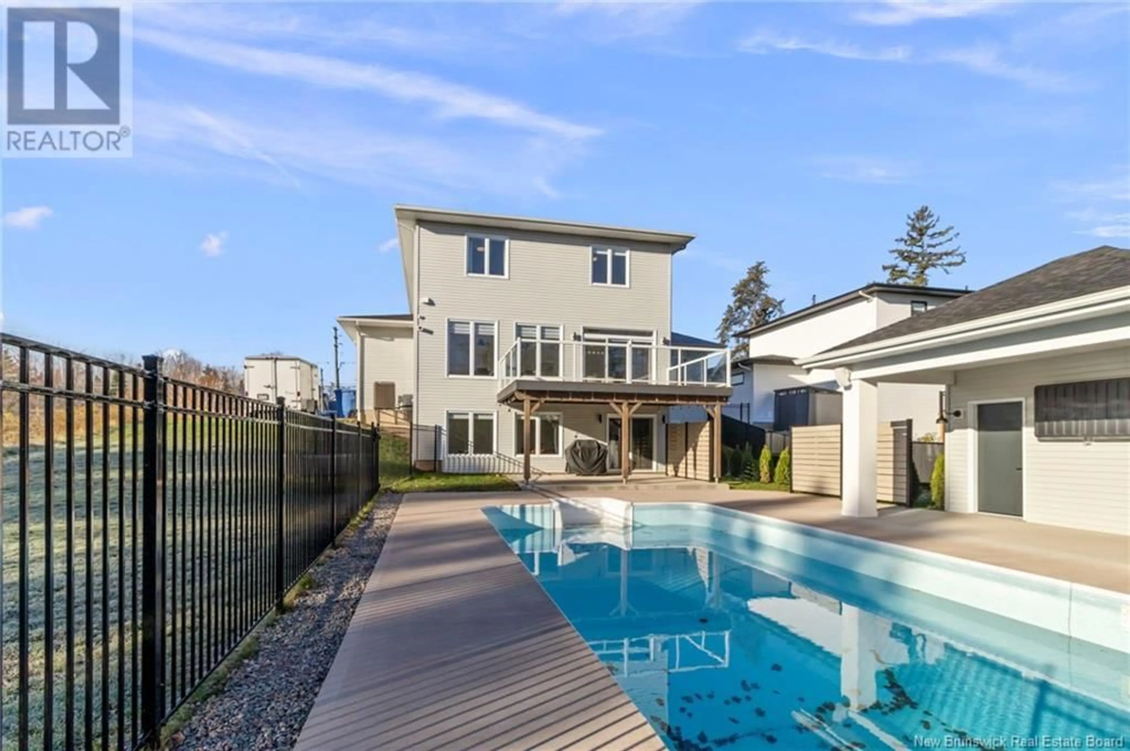 Frontside or backside of a home, the fenced backyard for 976 Bourque Road, Dieppe New Brunswick E1A7L3