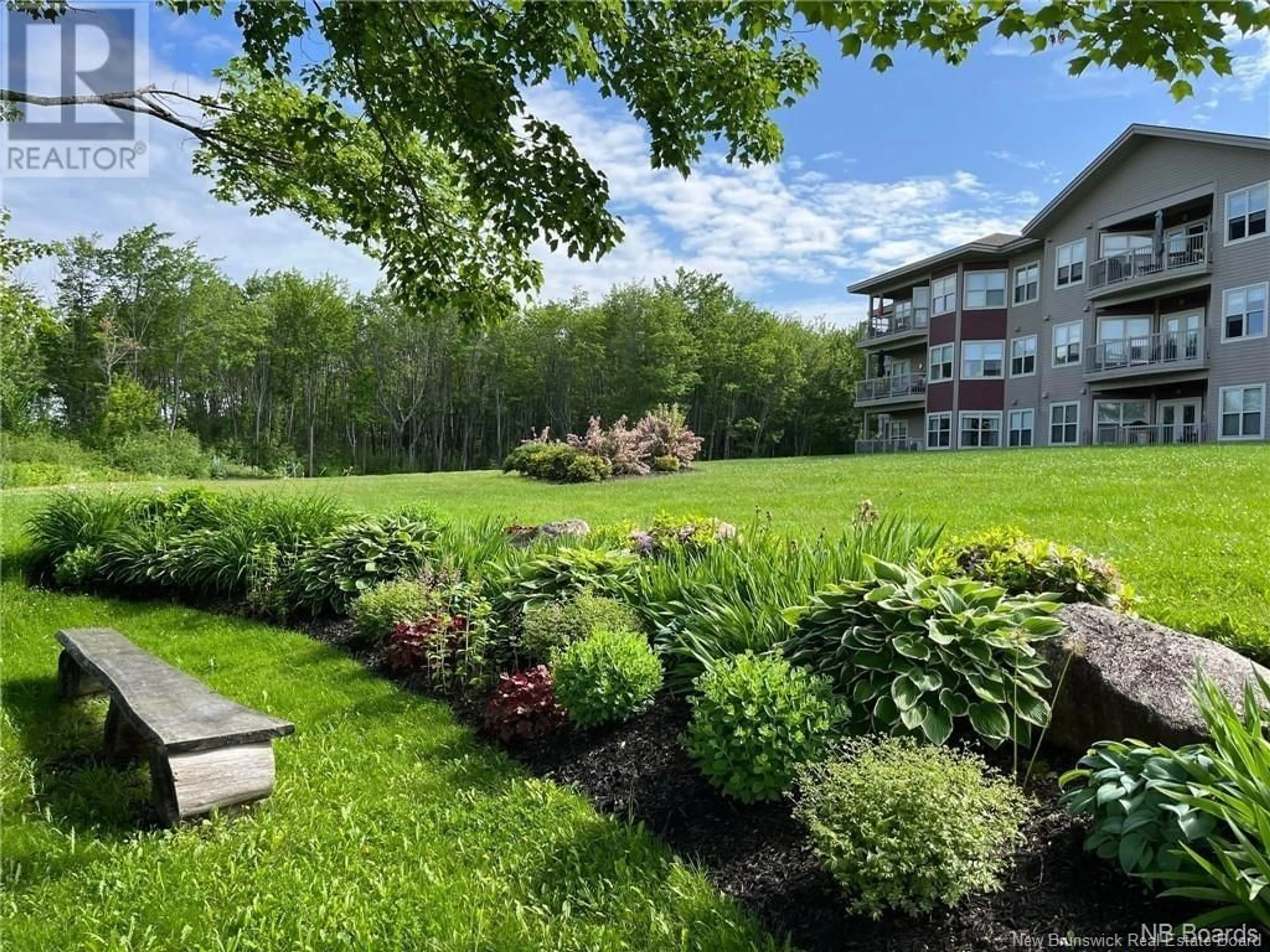 A pic from exterior of the house or condo, the fenced backyard for 55 Old Ferry Road Unit# Unit 205, Miramichi New Brunswick E1V0C2