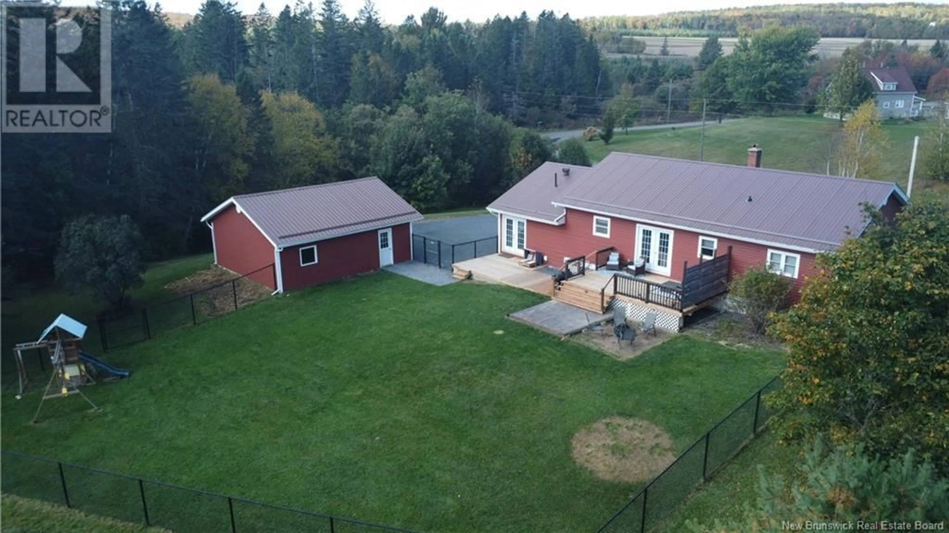 Frontside or backside of a home, the fenced backyard for 31 Chantler Drive, Perth-Andover New Brunswick E7H1R9