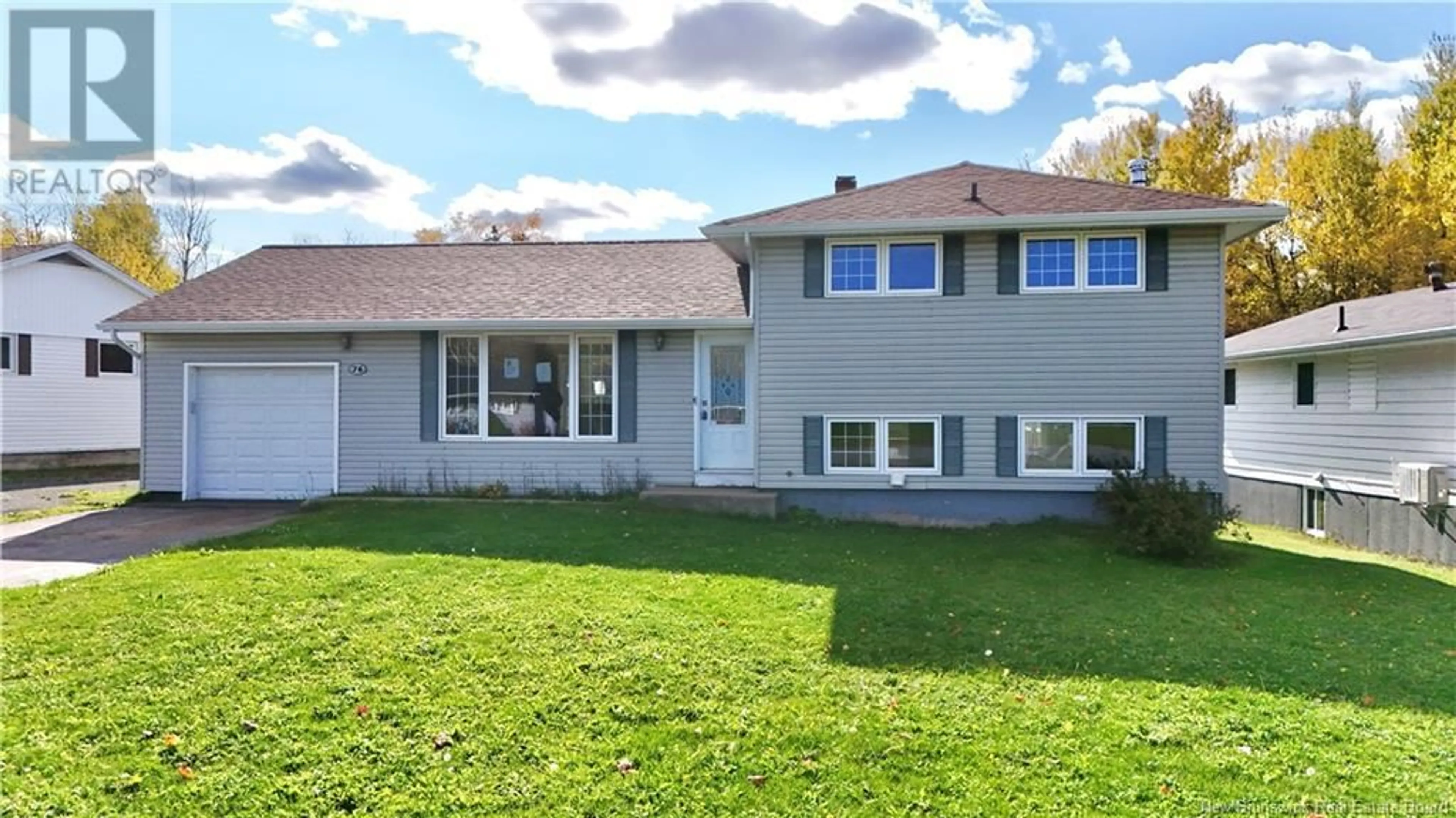 Frontside or backside of a home, the fenced backyard for 76 Chaleur Drive, Belledune New Brunswick E8G1Z4