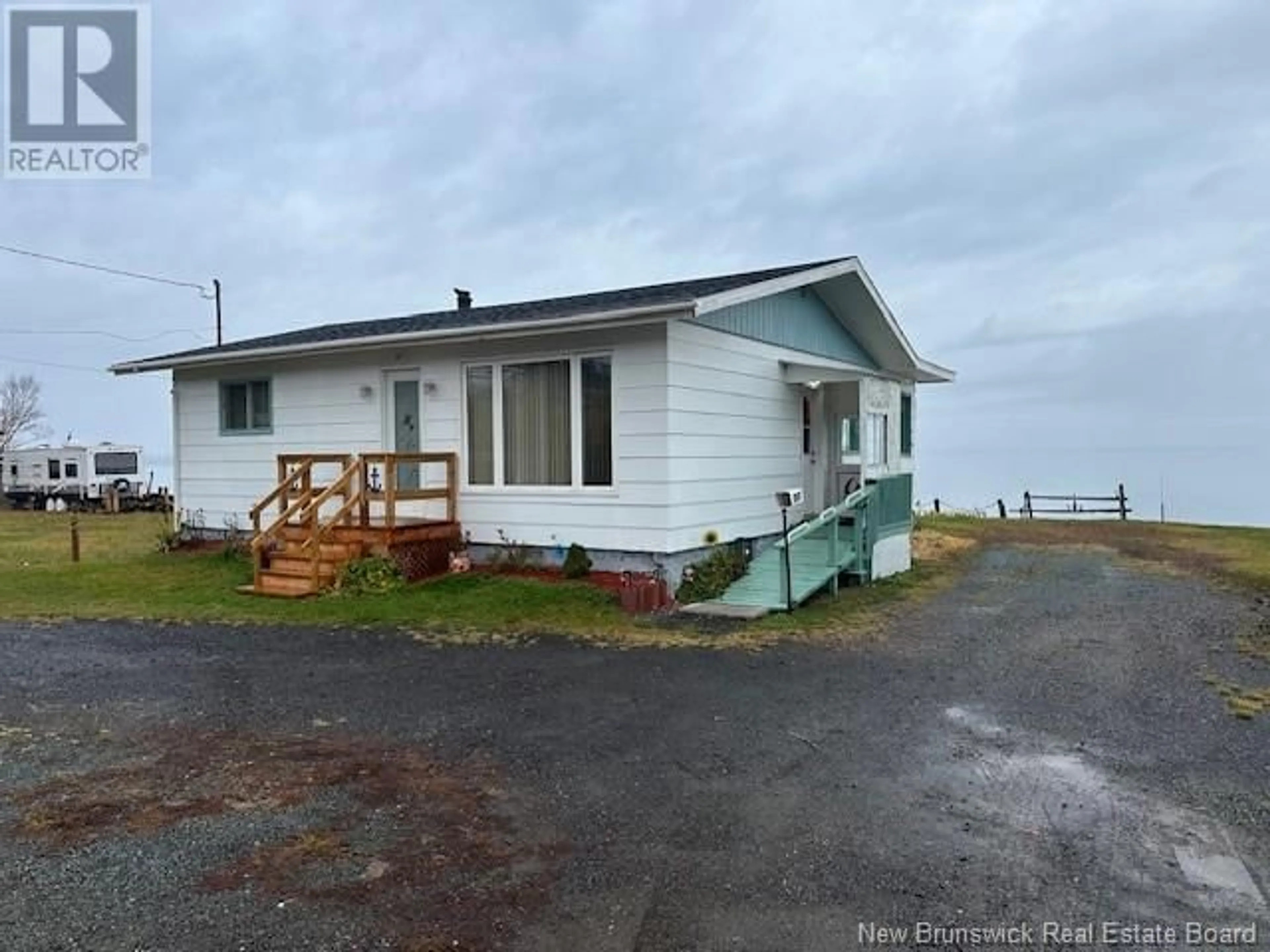 A pic from exterior of the house or condo, the front or back of building for 247 Chaleur, Charlo New Brunswick E8E2B8