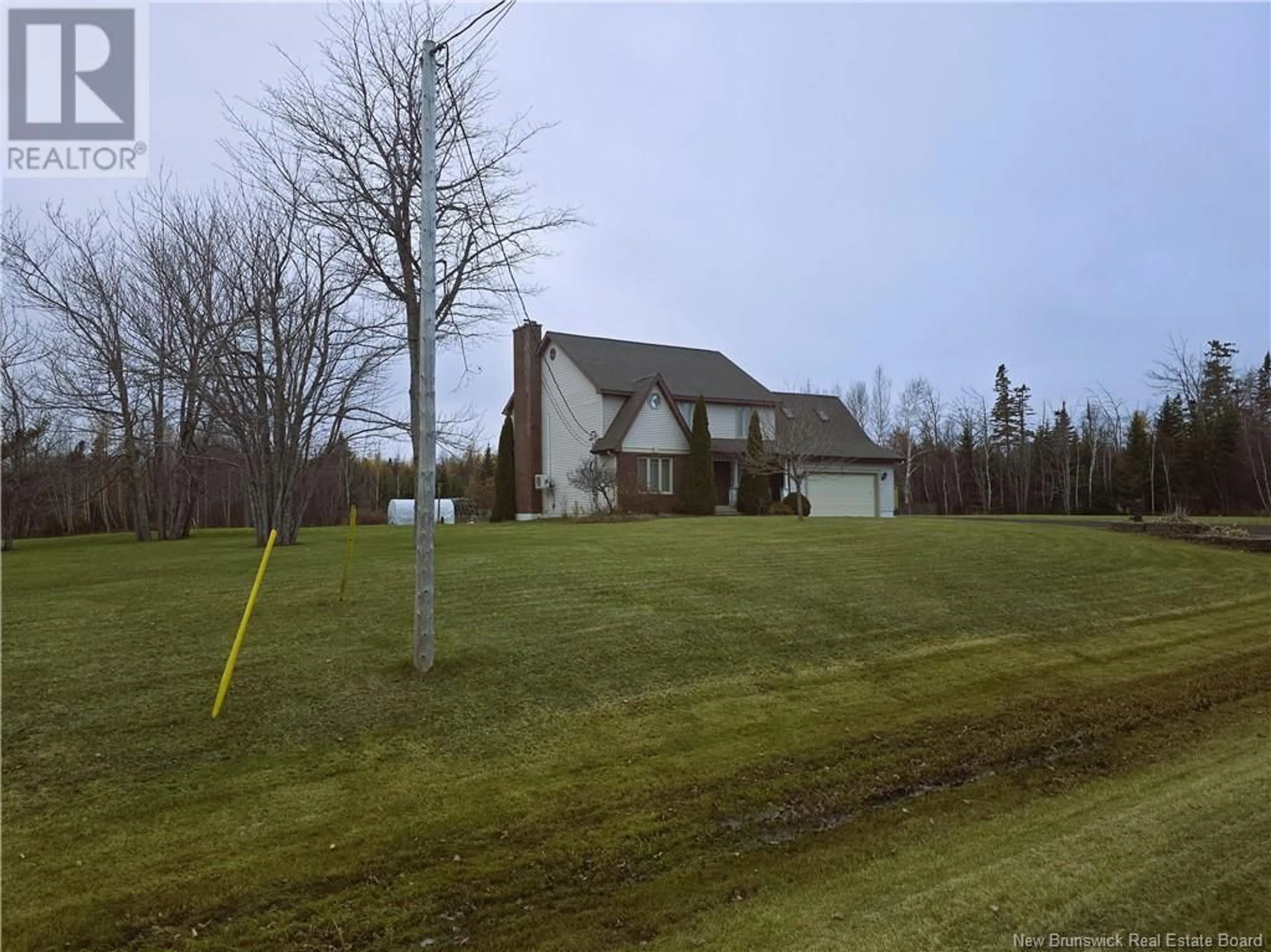 Frontside or backside of a home, the fenced backyard for 11219 Route 11, Pokemouche New Brunswick E8P1H9