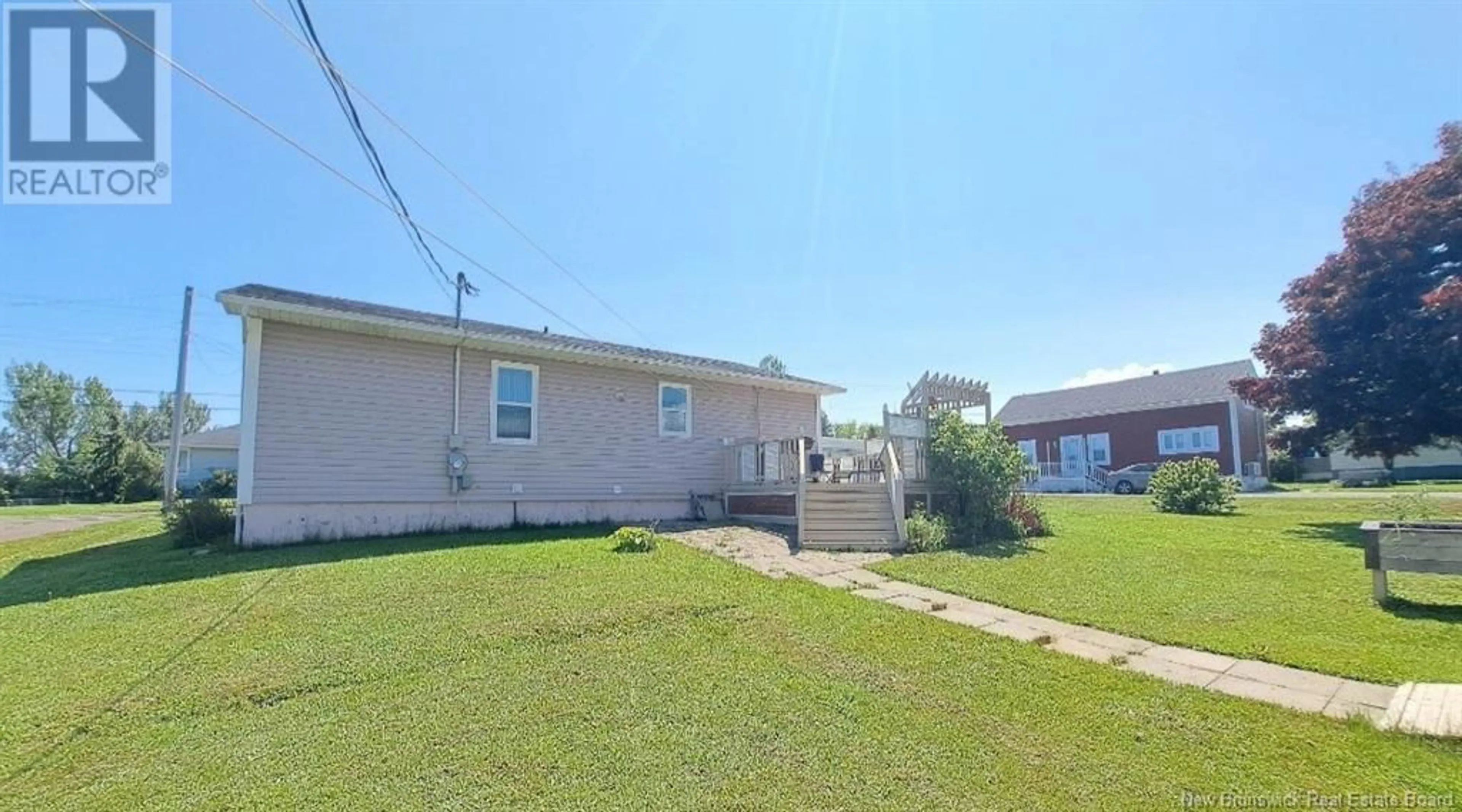 A pic from exterior of the house or condo, the fenced backyard for 399 Rue Arseneau, Tracadie New Brunswick E1X1B3