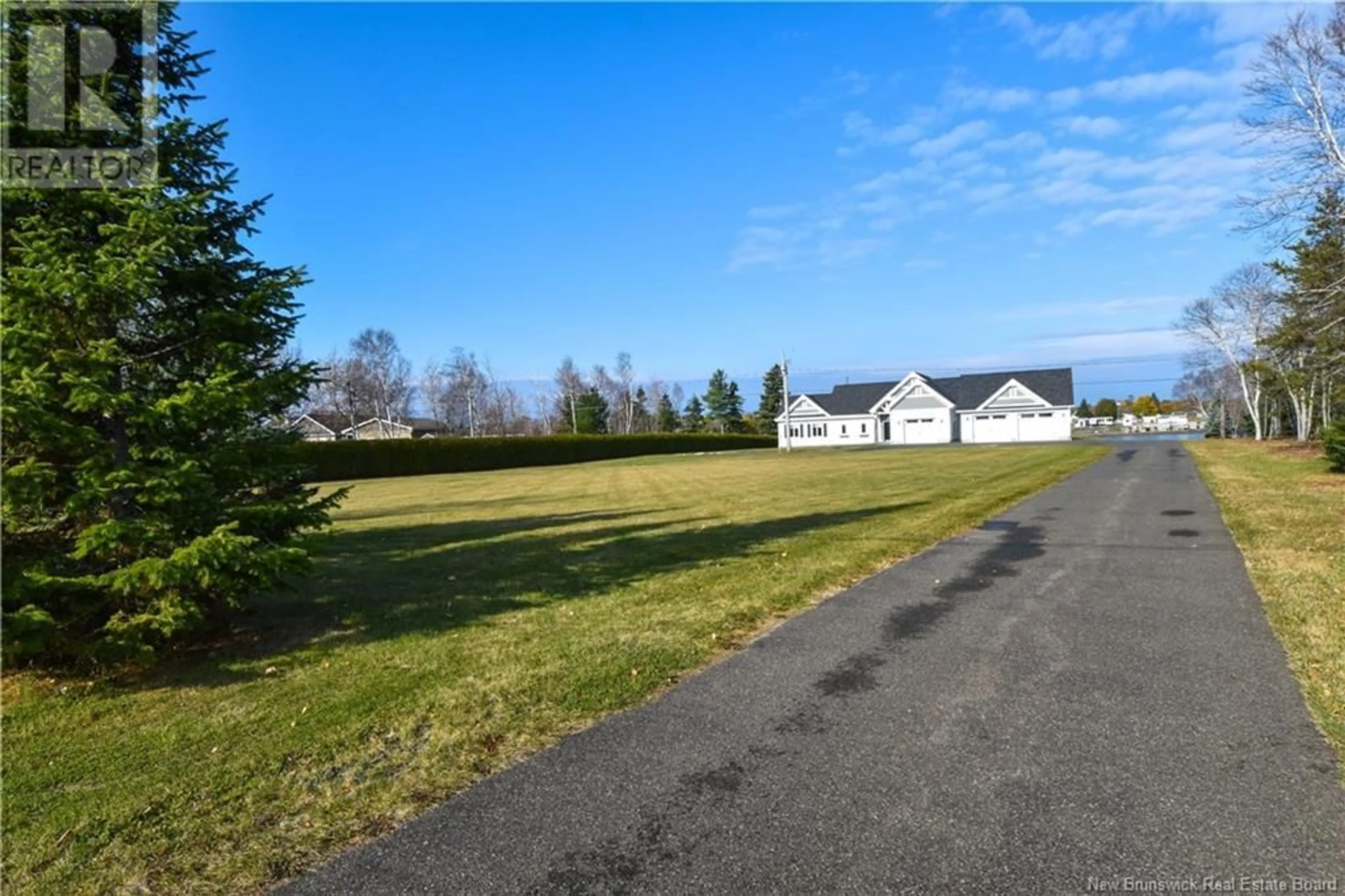 Frontside or backside of a home, the fenced backyard for 635 Pointe-à-Tom, Pointe-À-Tom New Brunswick E1X3X5