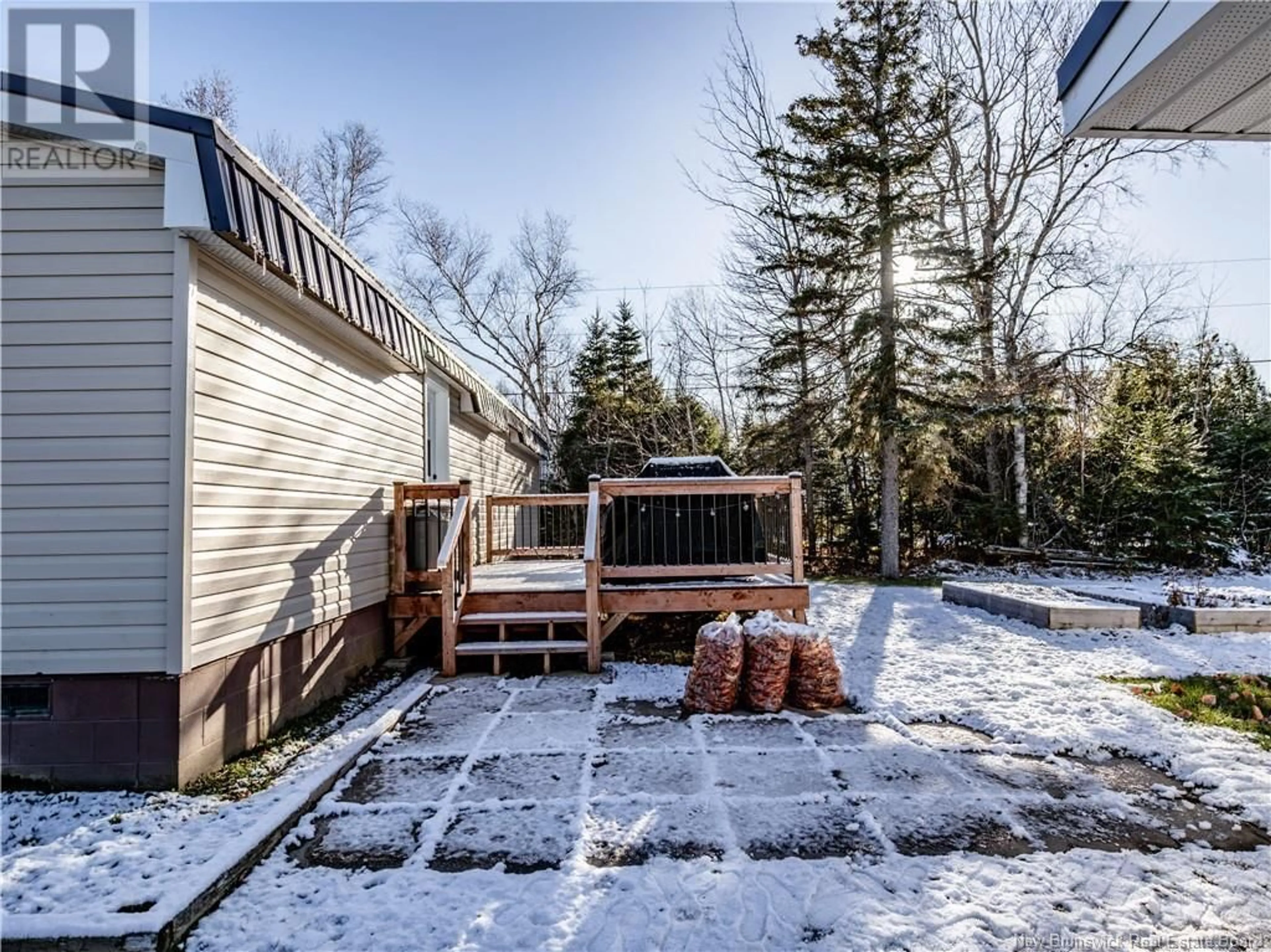 Patio, the fenced backyard for 125 Ch Pointe Des Georges, Aldouane New Brunswick E4W5H6