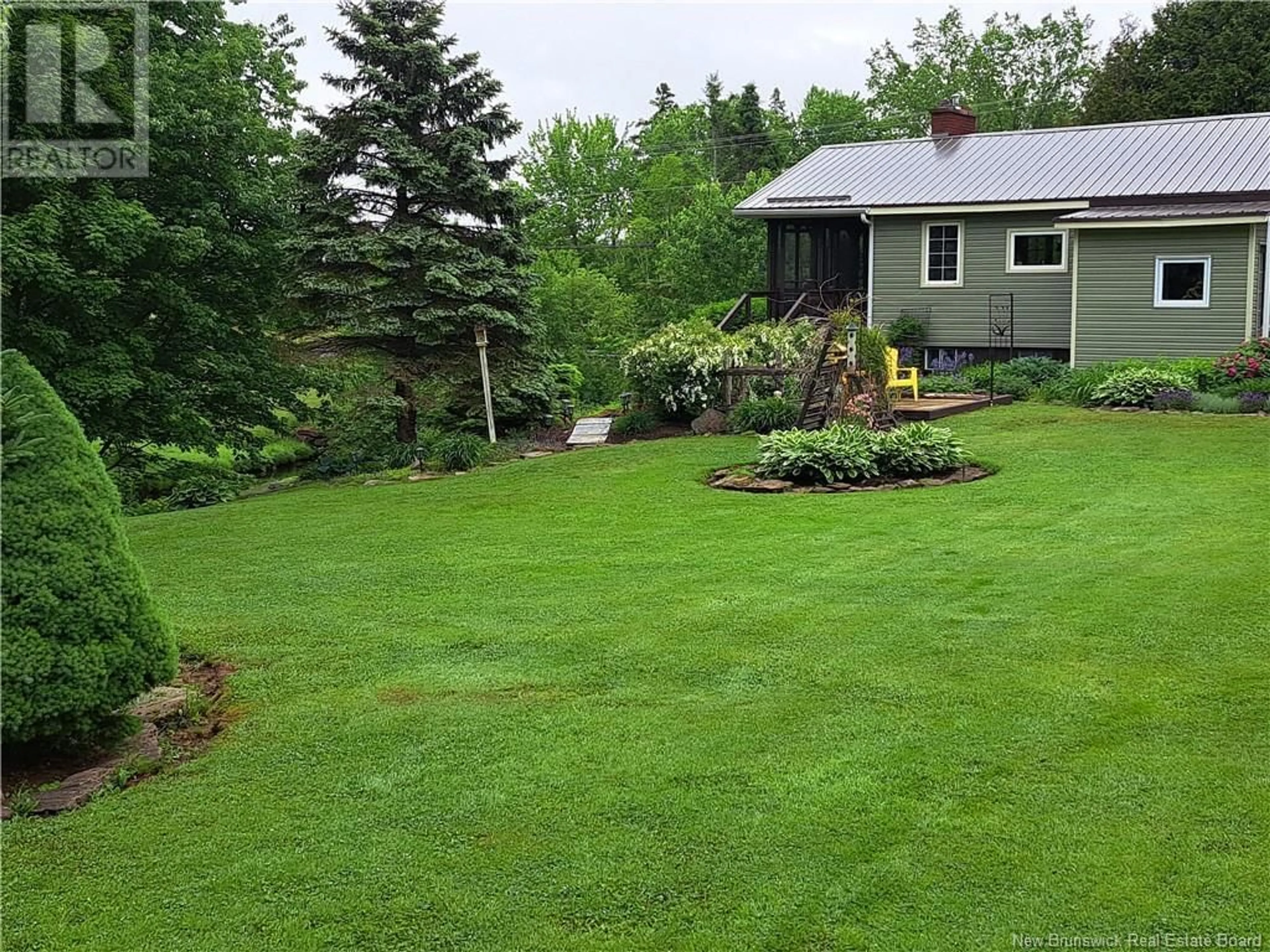 Frontside or backside of a home, the fenced backyard for 780 Weisner Road, Saint-Philippe New Brunswick E1H1T7