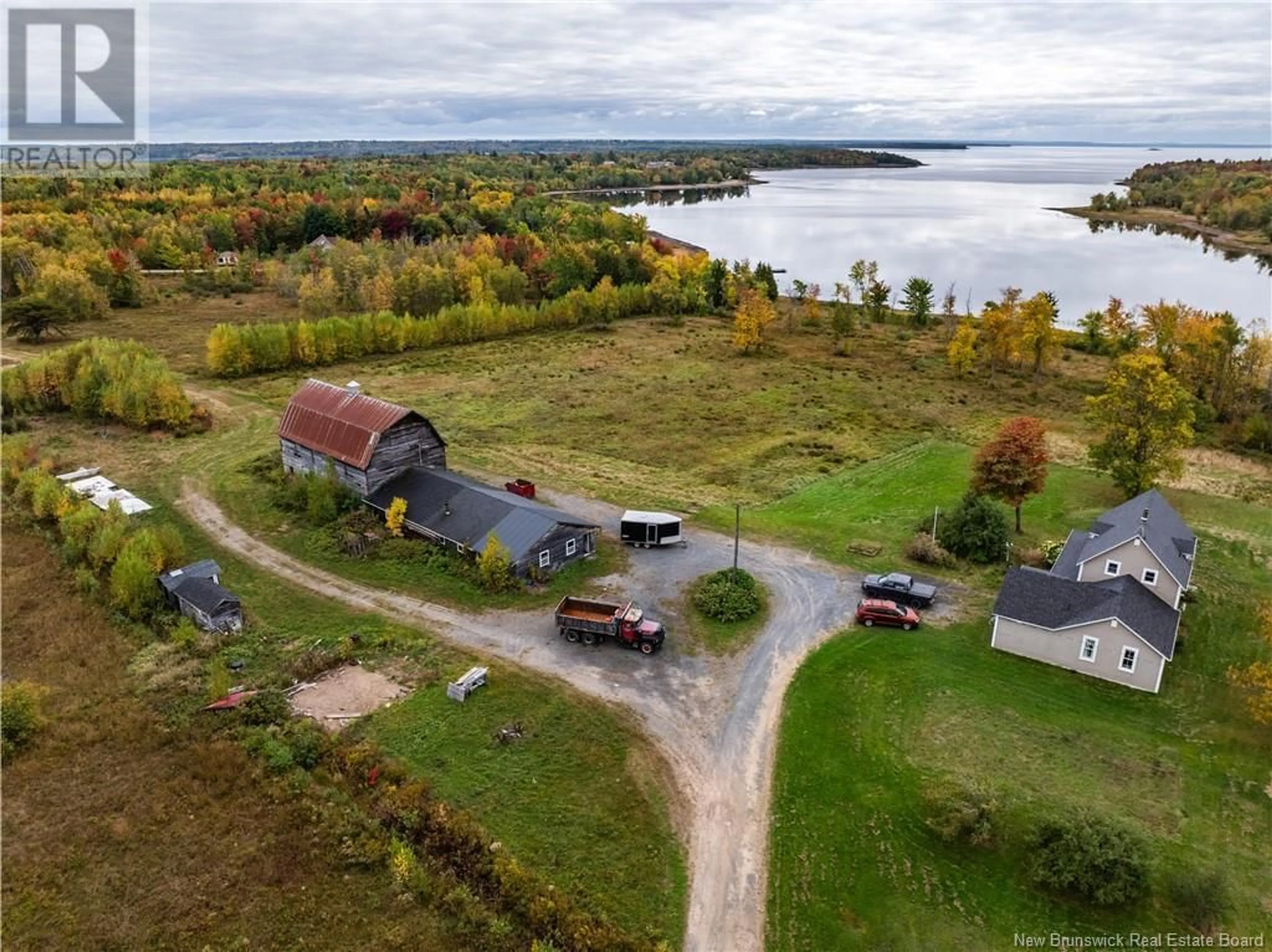 A pic from outside/outdoor area/front of a property/back of a property/a pic from drone, water/lake/river/ocean view for 28 CHAPMAN ROAD, Newcastle Creek New Brunswick E4B2L6