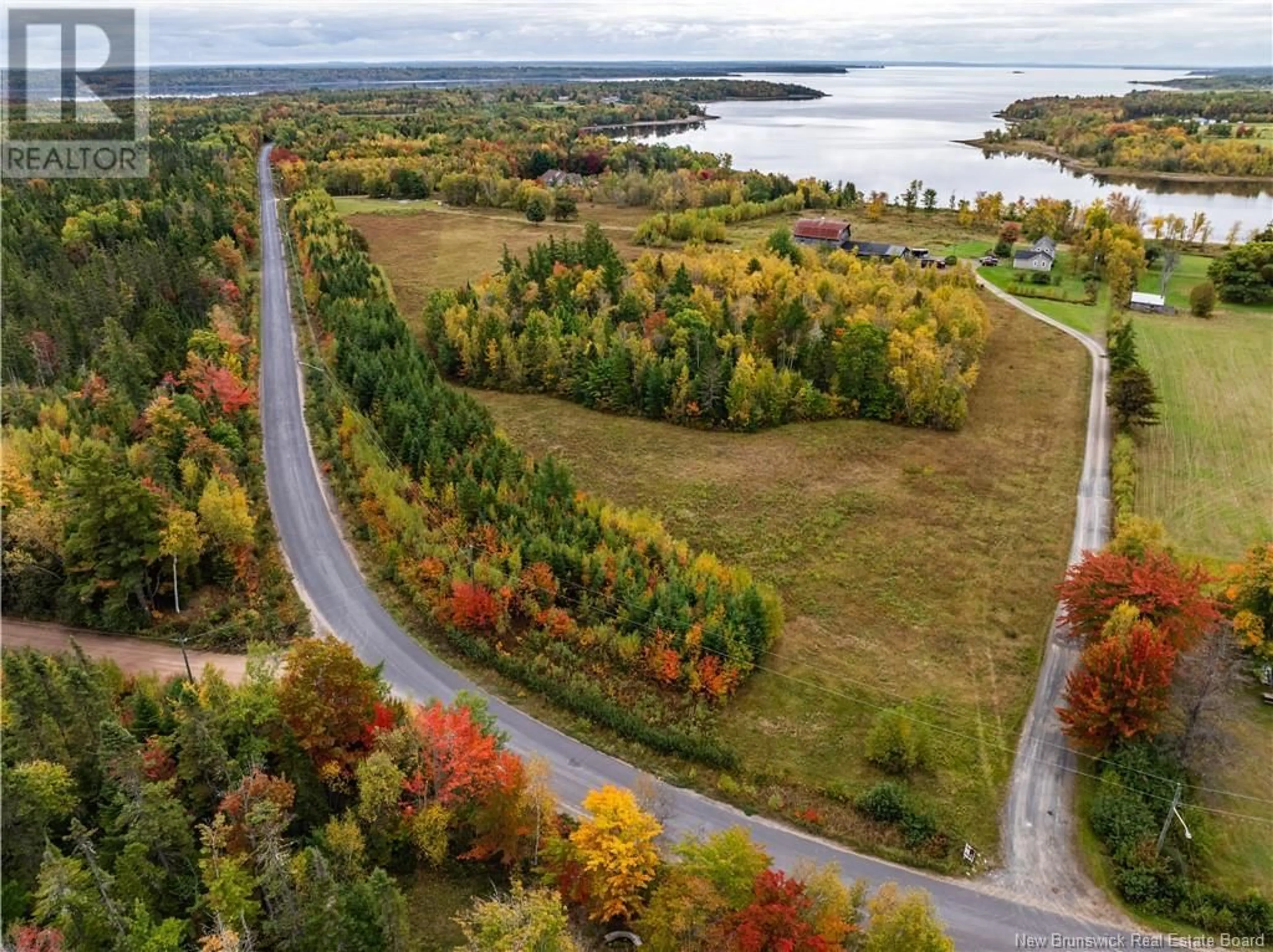 A pic from outside/outdoor area/front of a property/back of a property/a pic from drone, water/lake/river/ocean view for 28 CHAPMAN ROAD, Newcastle Creek New Brunswick E4B2L6