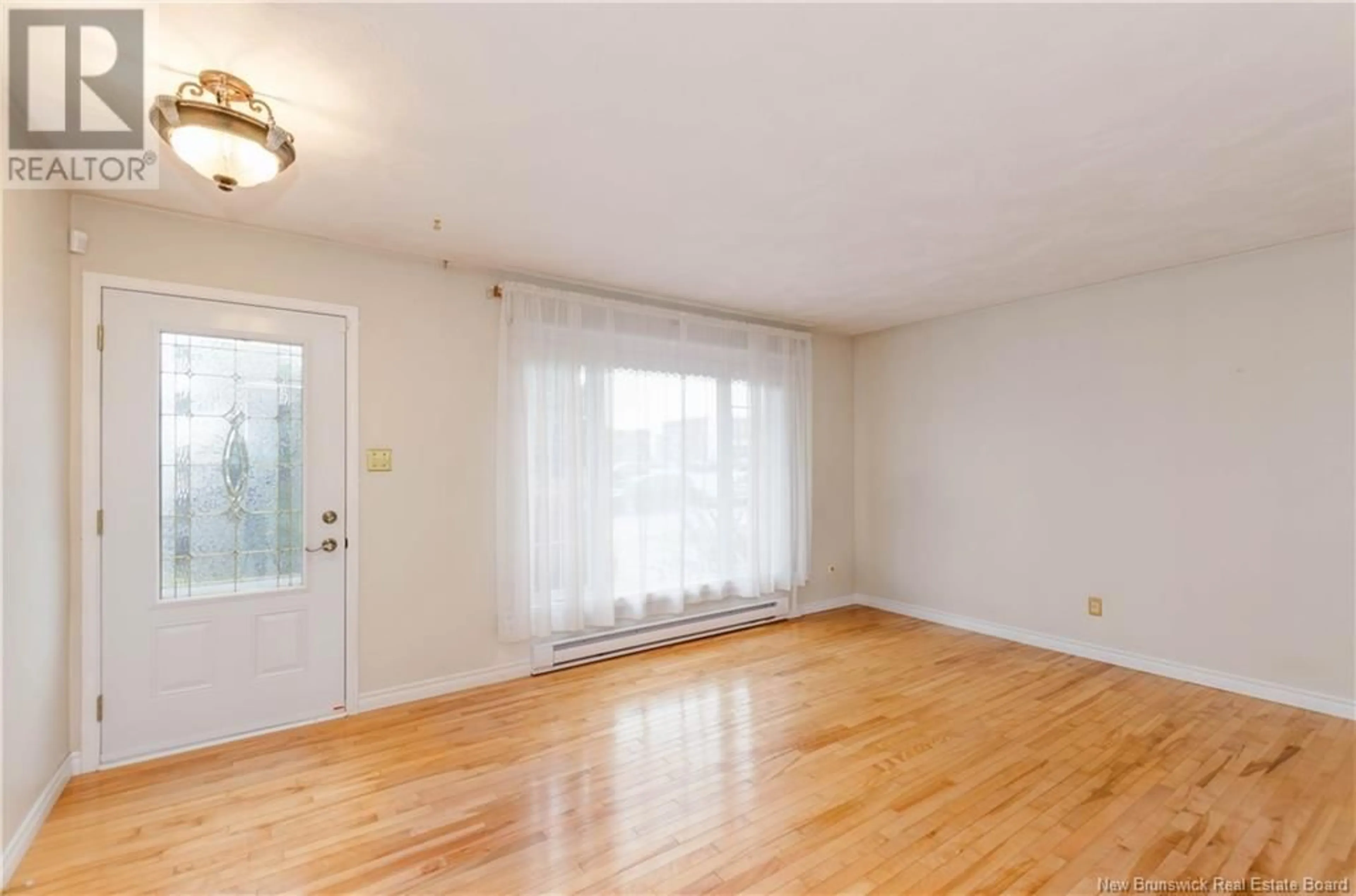 A pic of a room, wood floors for 275 Cousteau, Dieppe New Brunswick E1A5W3