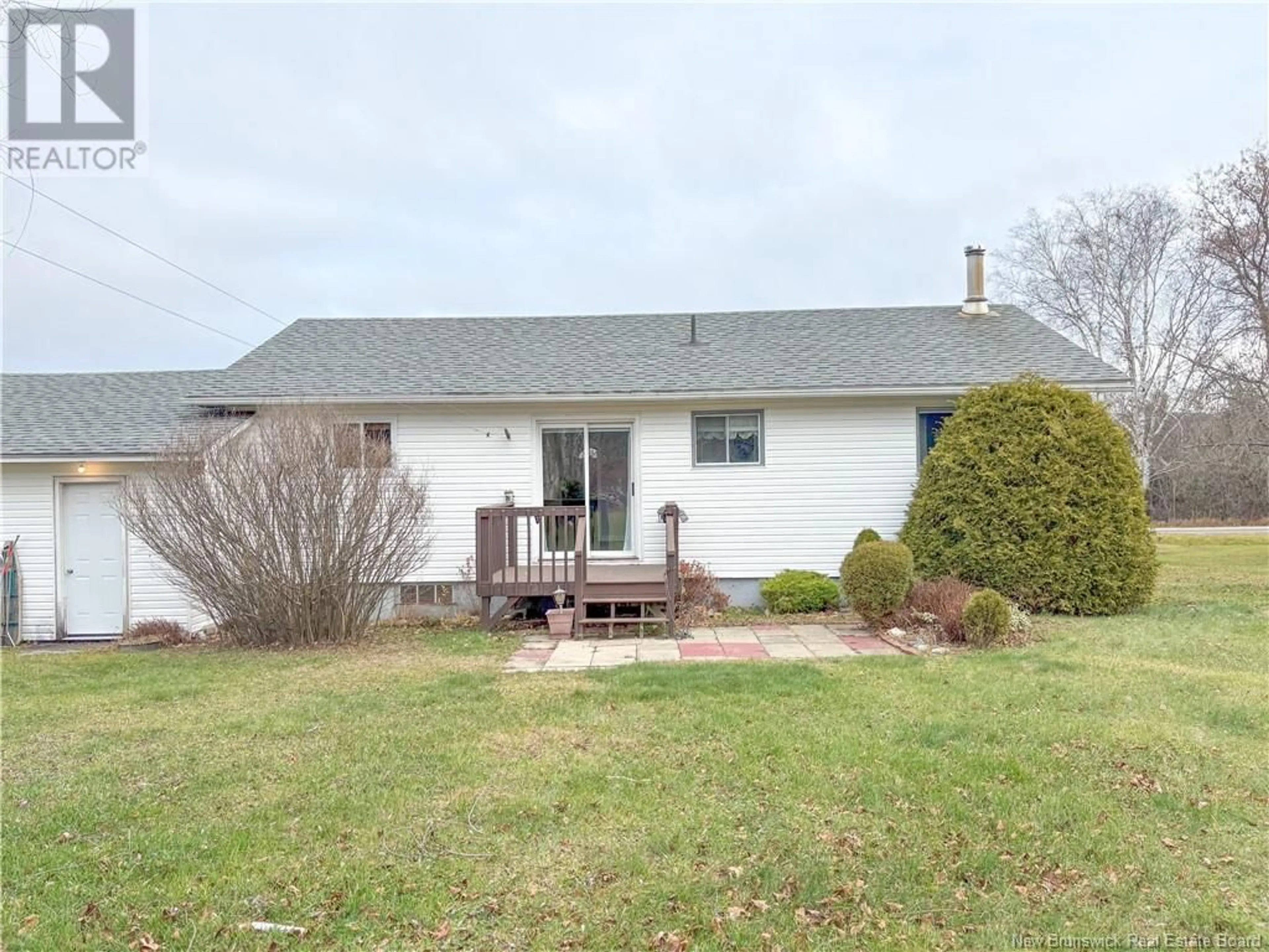 Frontside or backside of a home, the fenced backyard for 98 Curtis Road, Florenceville-Bristol New Brunswick E7L2H2