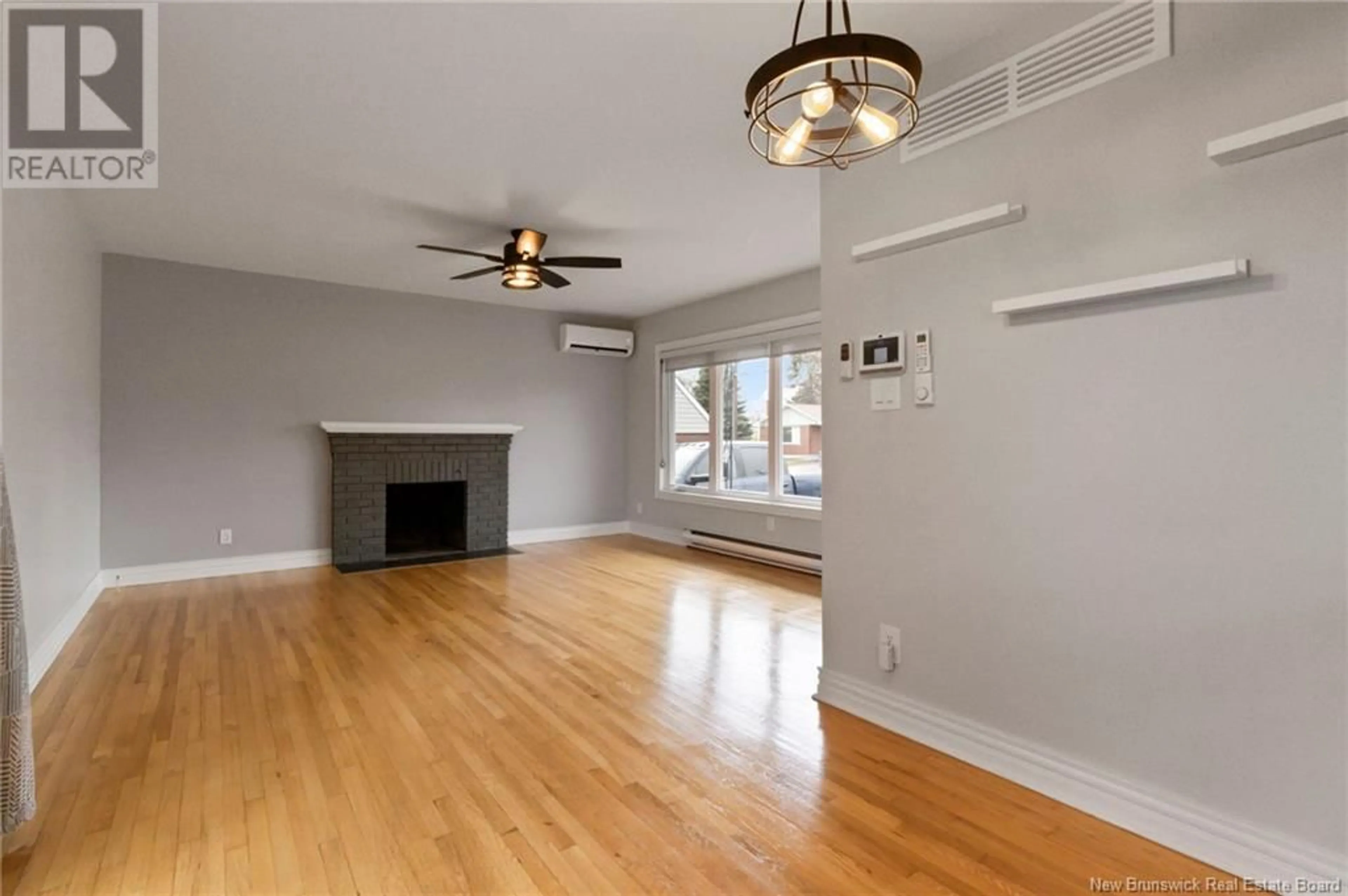 A pic of a room, wood floors for 65 Macbeath Avenue, Moncton New Brunswick E1C6Z2