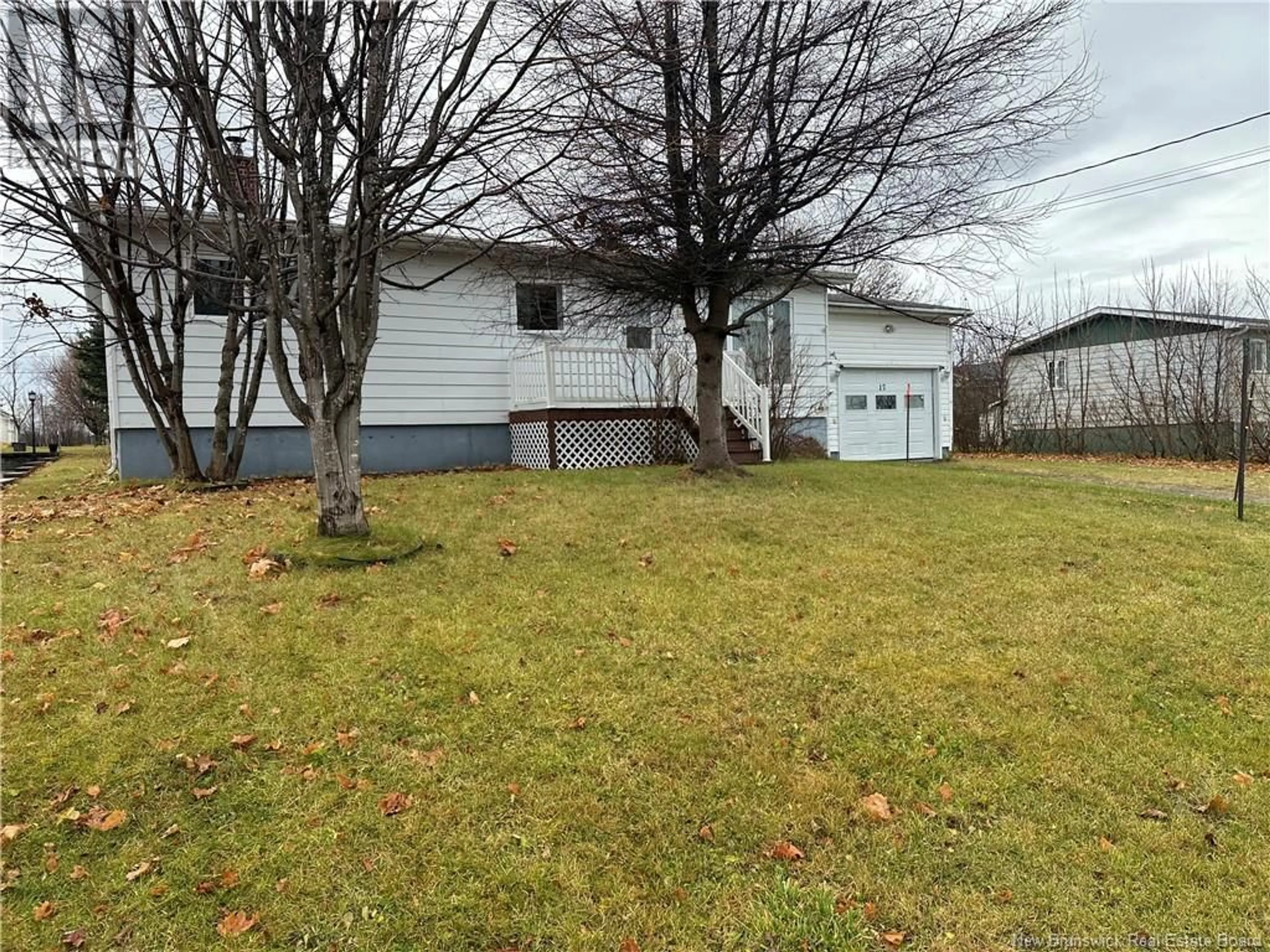 Frontside or backside of a home, the fenced backyard for 17 Colette Street, Charlo New Brunswick E8E2H8