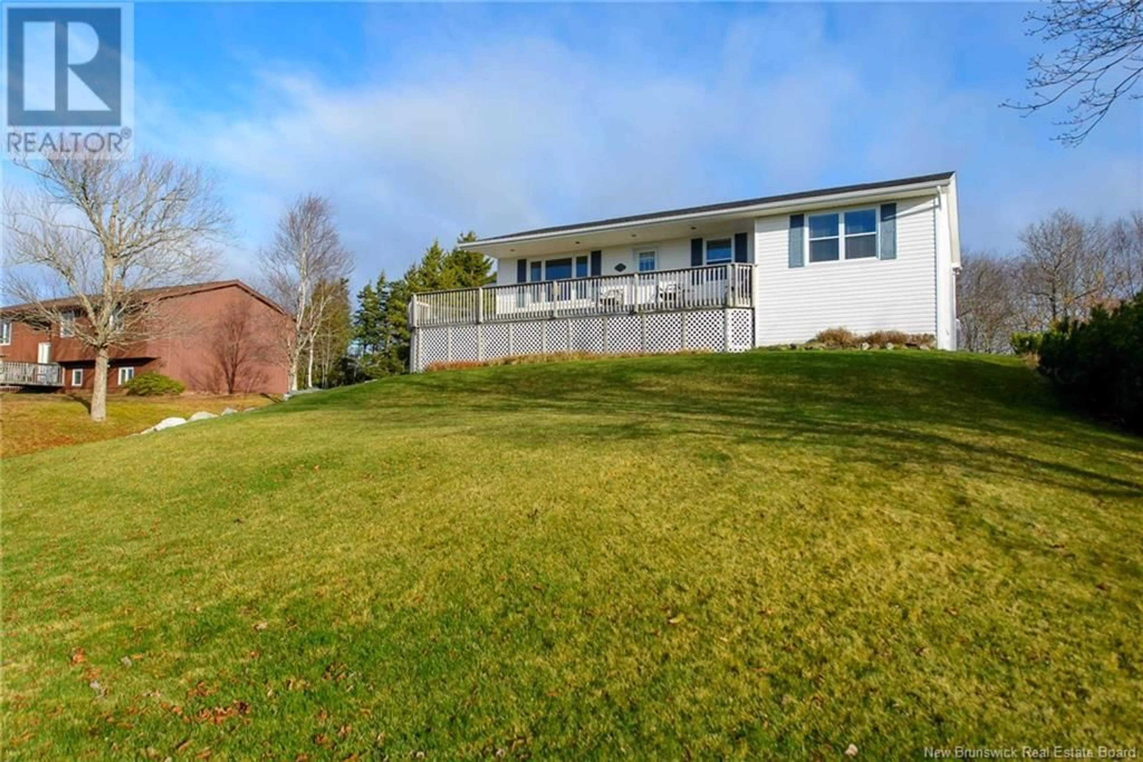 Frontside or backside of a home, the fenced backyard for 15 Sundance Drive, Quispamsis New Brunswick E2E2S3