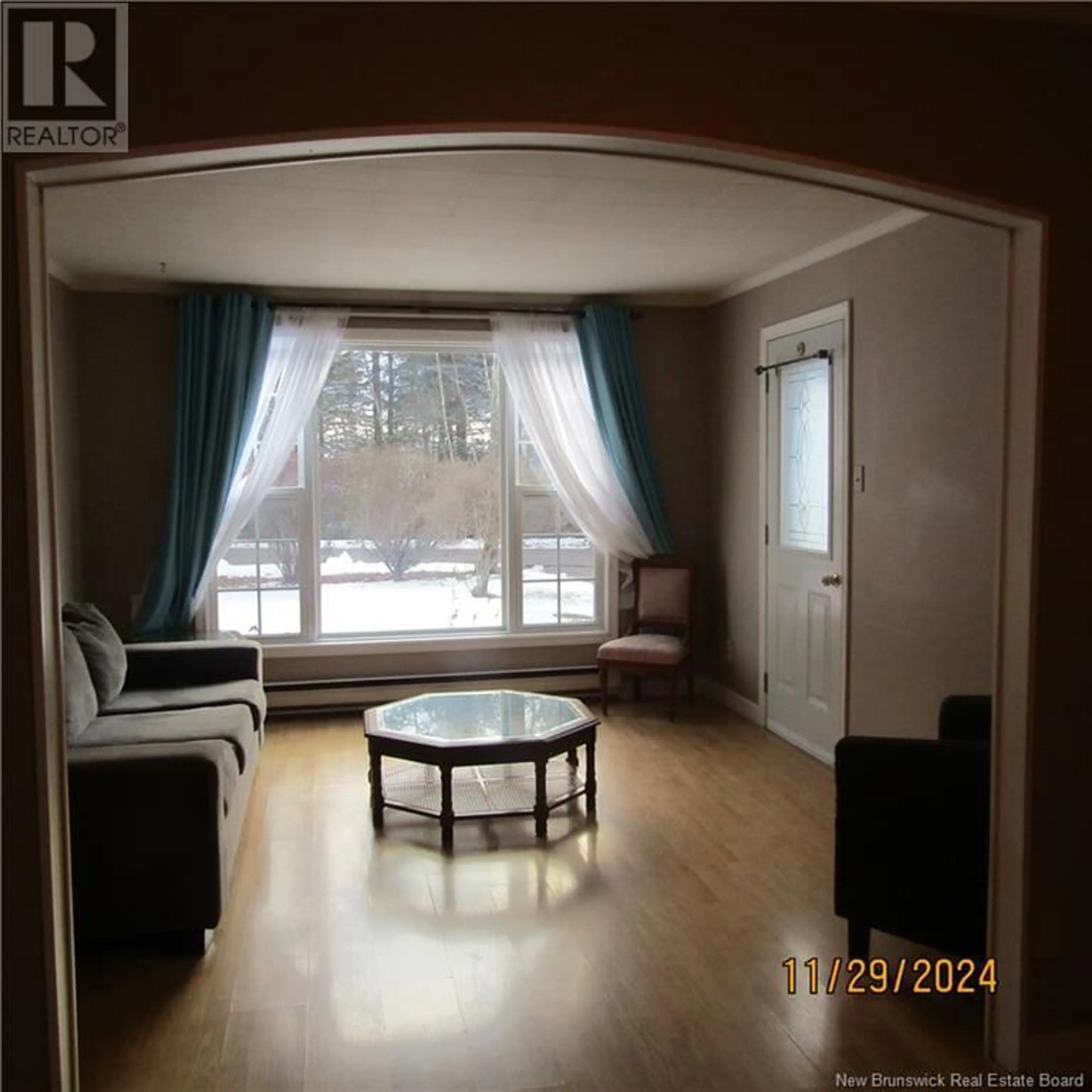 Living room with furniture, wood/laminate floor for 71 YOUNG ROAD, Pennfield New Brunswick E5H1Z2
