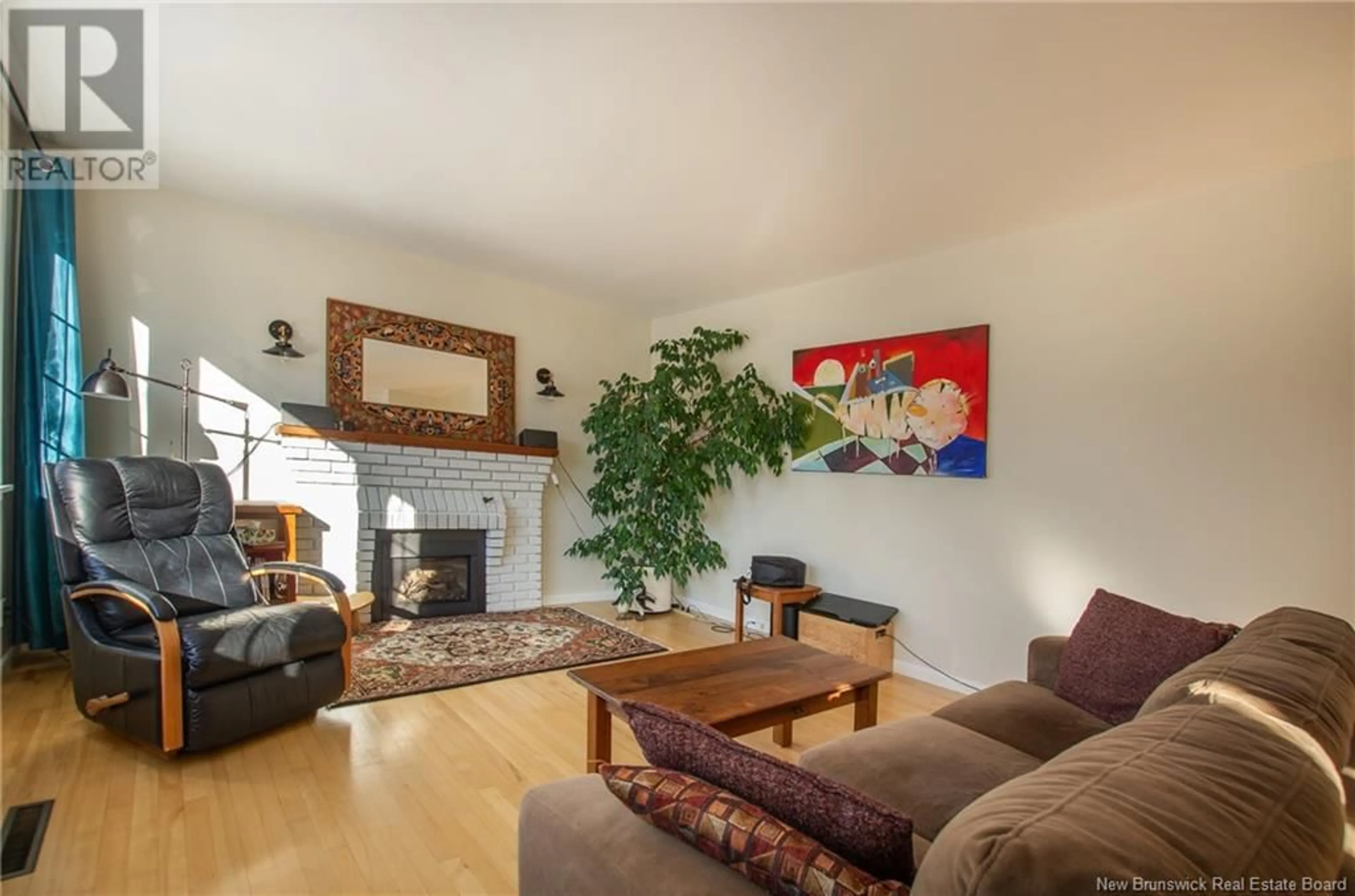 Living room with furniture, wood/laminate floor for 43 Walsh Street, Moncton New Brunswick E1C6W6