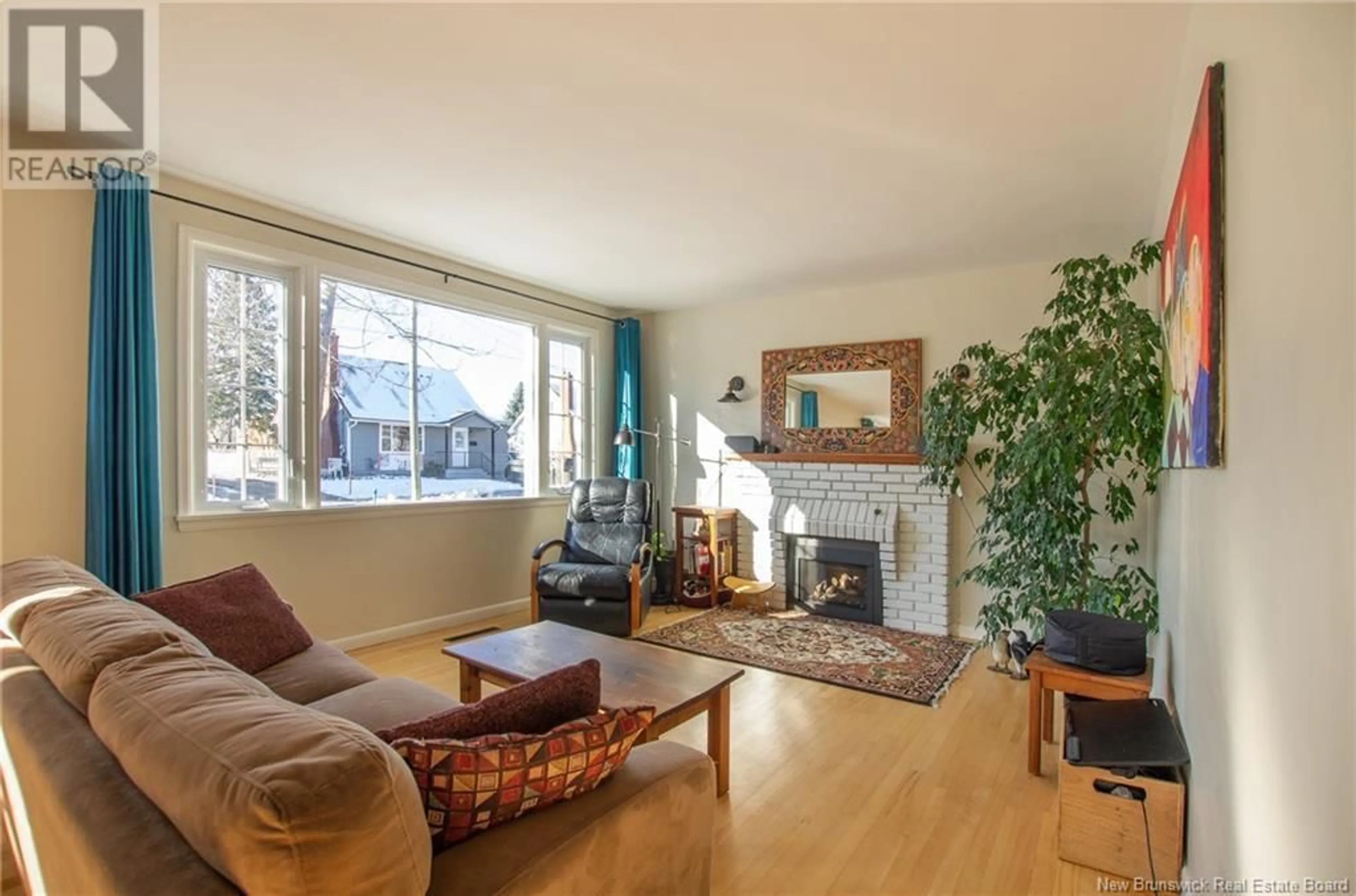 Living room with furniture, wood/laminate floor for 43 Walsh Street, Moncton New Brunswick E1C6W6