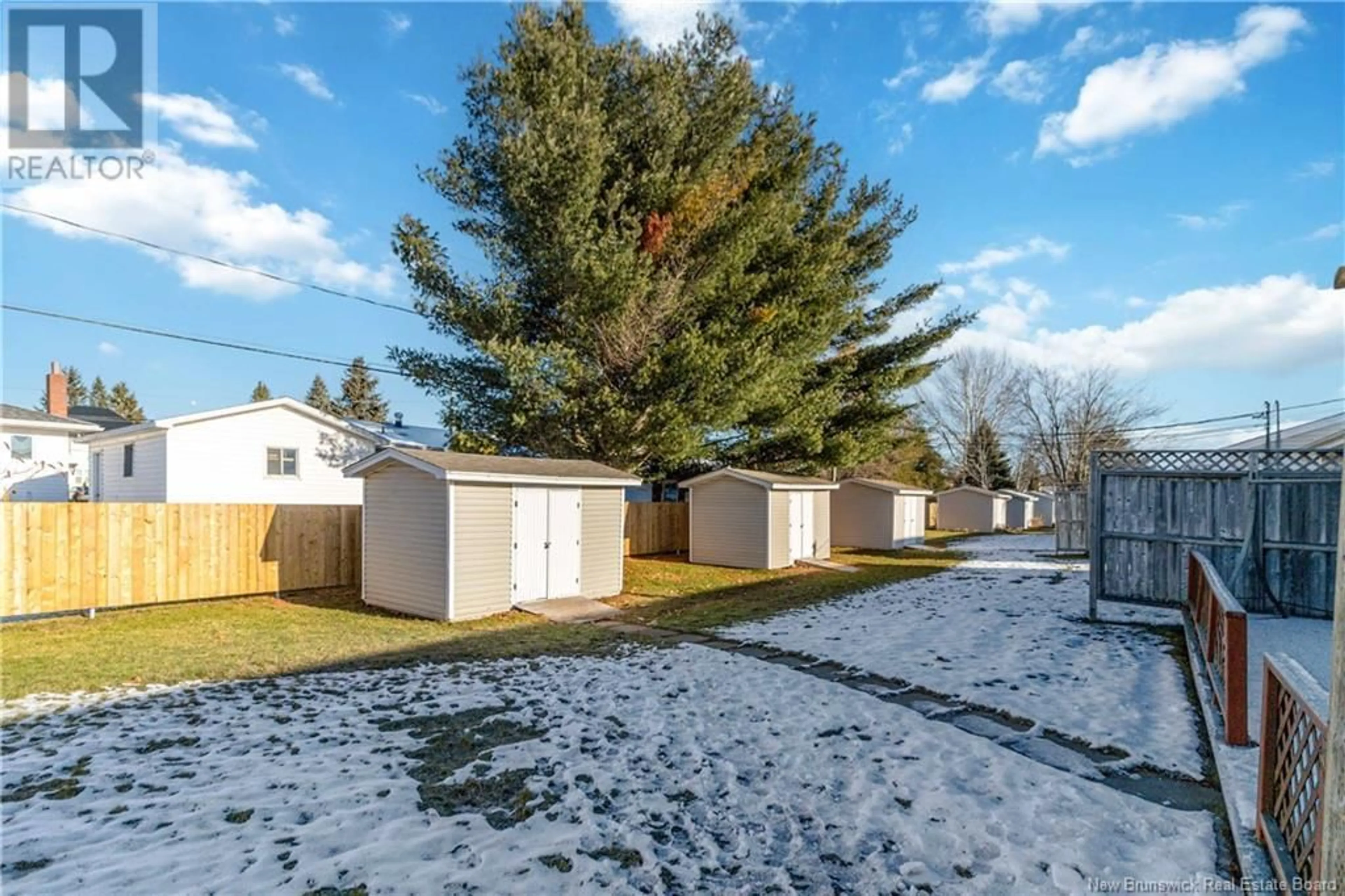 A pic from exterior of the house or condo, the fenced backyard for 268 Acadie Avenue Unit# 189, Dieppe New Brunswick E1A6T2