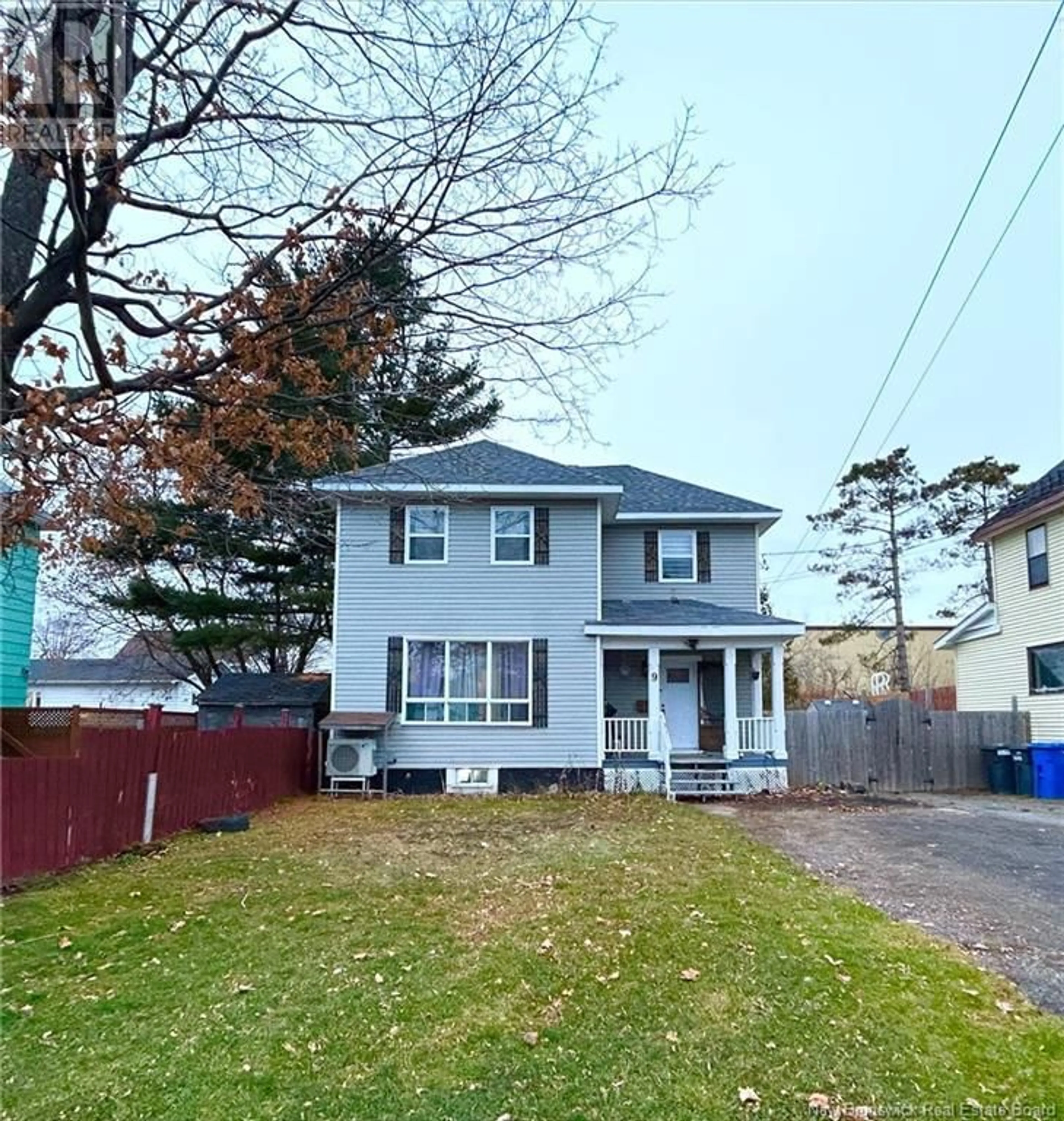 Frontside or backside of a home, the fenced backyard for 9 King Street, Campbellton New Brunswick E3N1C1