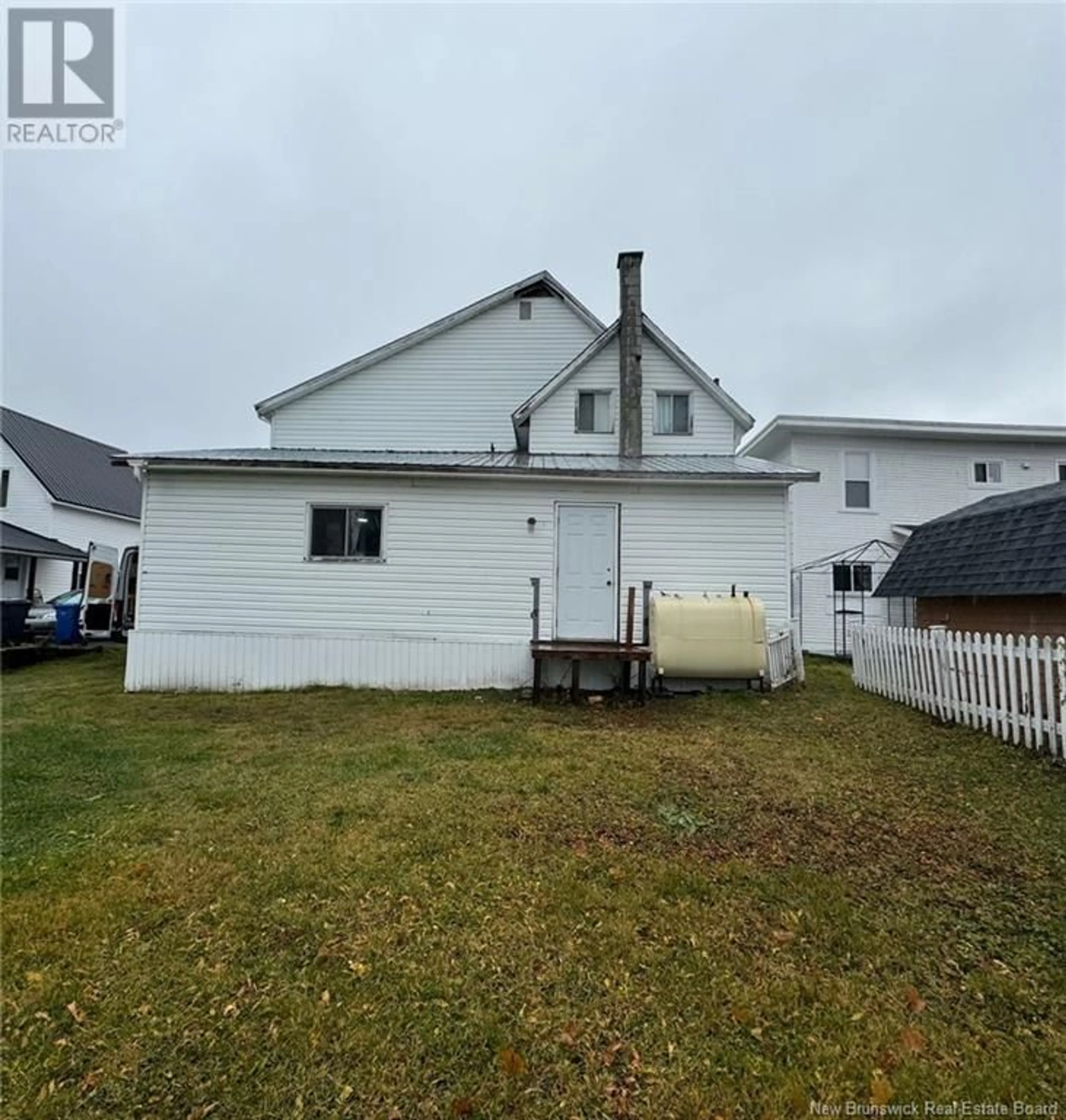 Frontside or backside of a home, the fenced backyard for 41 Duncan Street, Campbellton New Brunswick E3N2K4