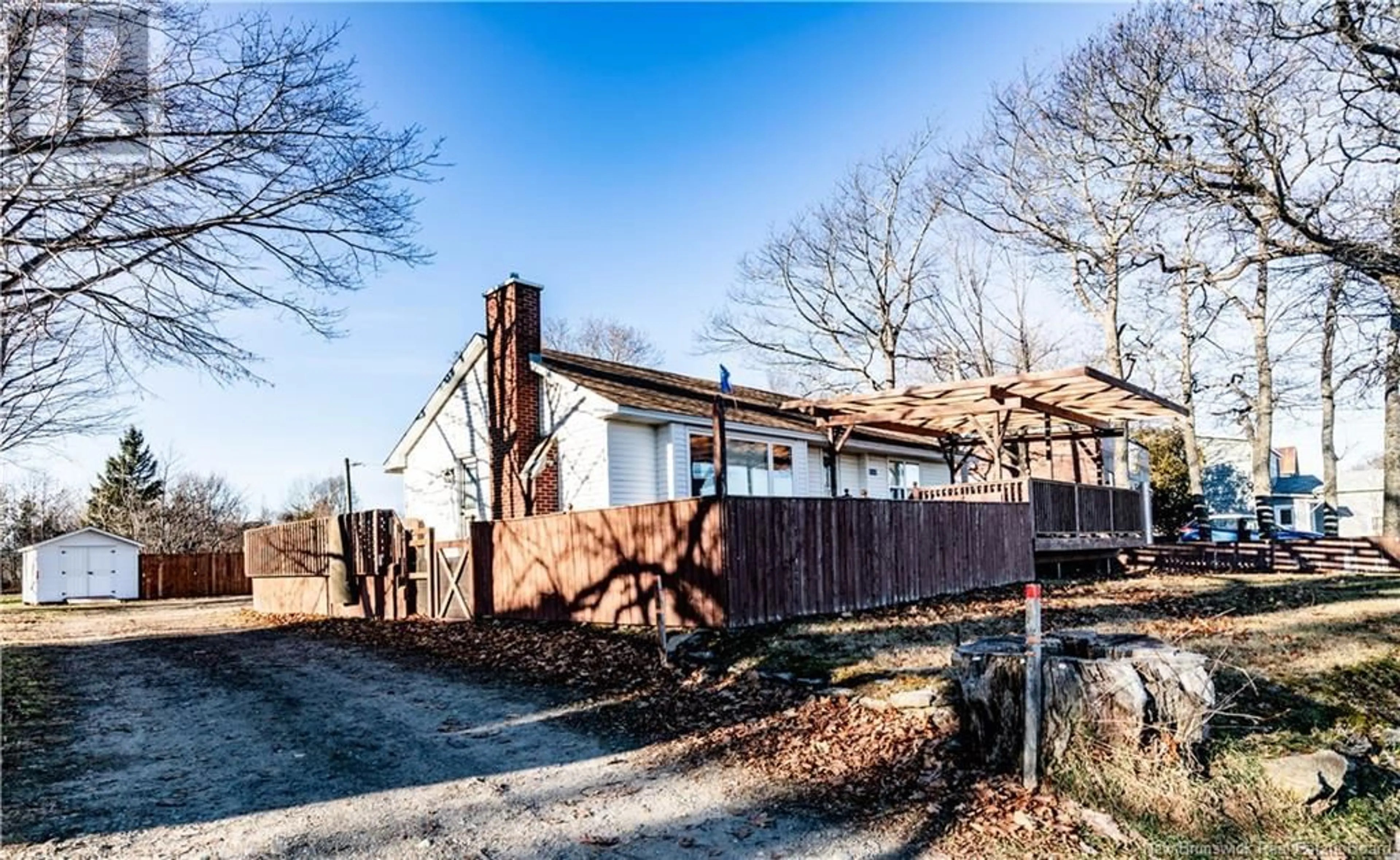 A pic from exterior of the house or condo, the fenced backyard for 9344 Main Street, Richibucto New Brunswick E4W4C8