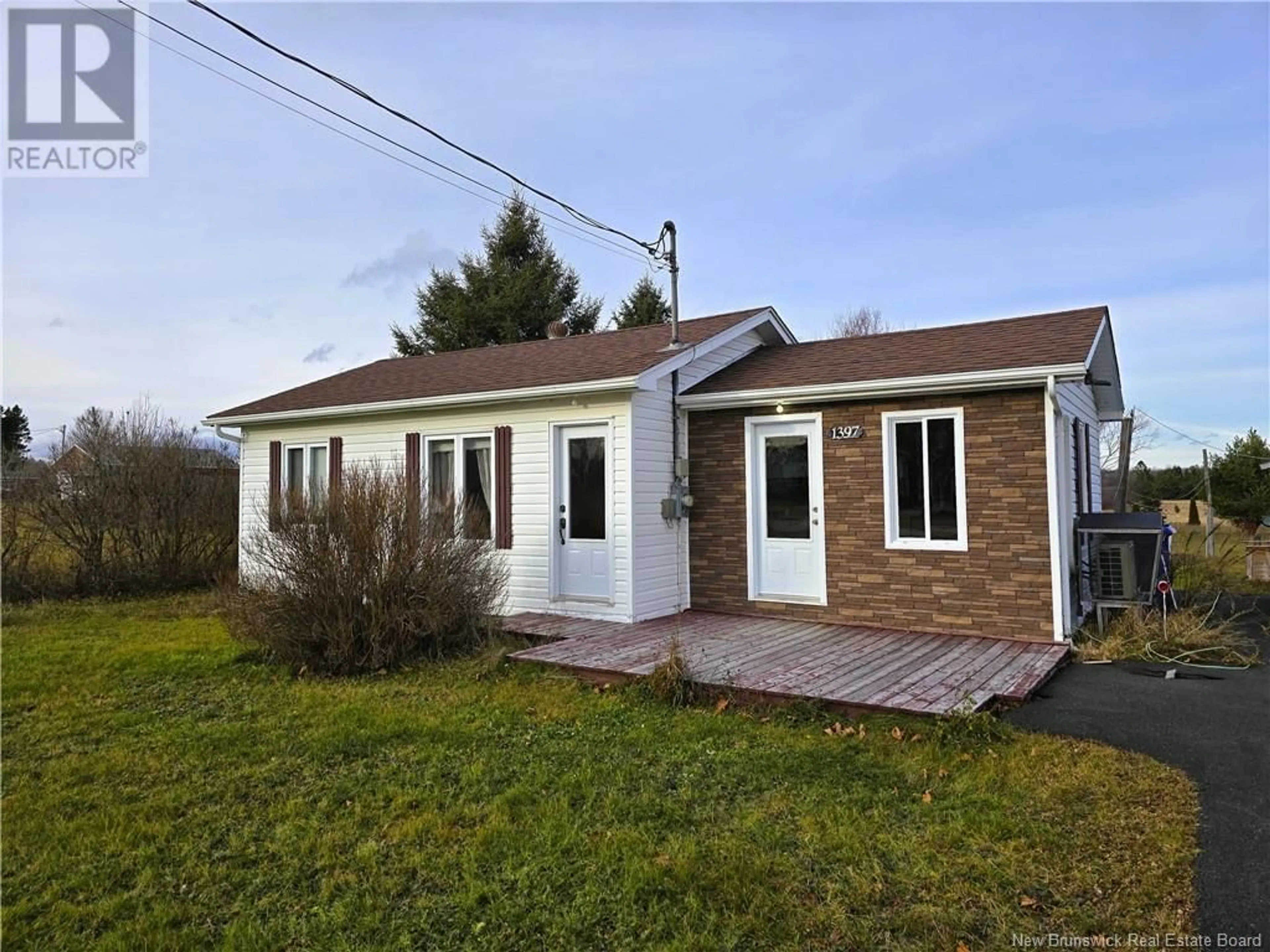 Home with vinyl exterior material, street for 1397 Route 355, Sainte Rose New Brunswick E1X2W4