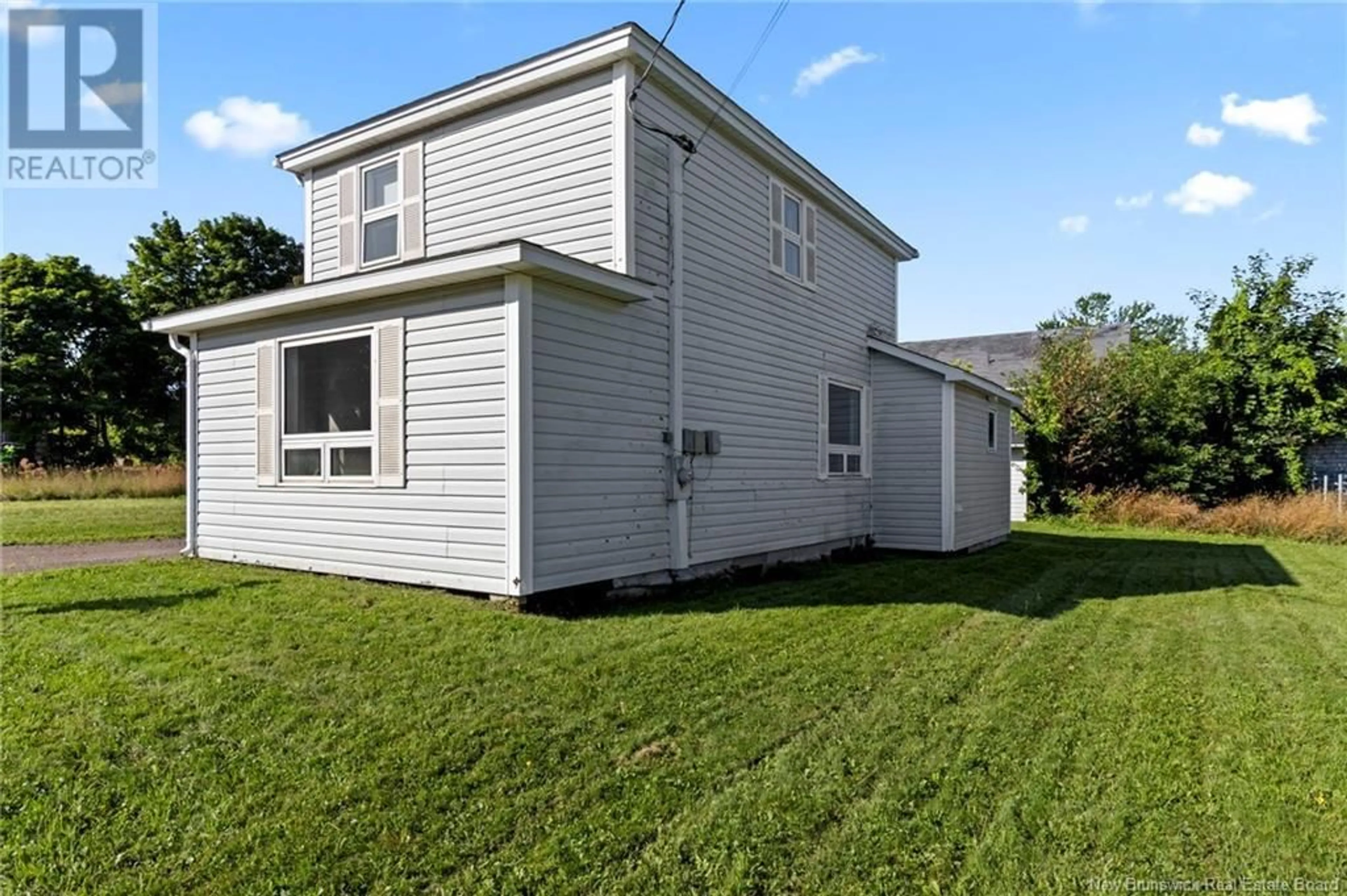 Frontside or backside of a home, the fenced backyard for 61 Mill, Shediac New Brunswick E4P2H8